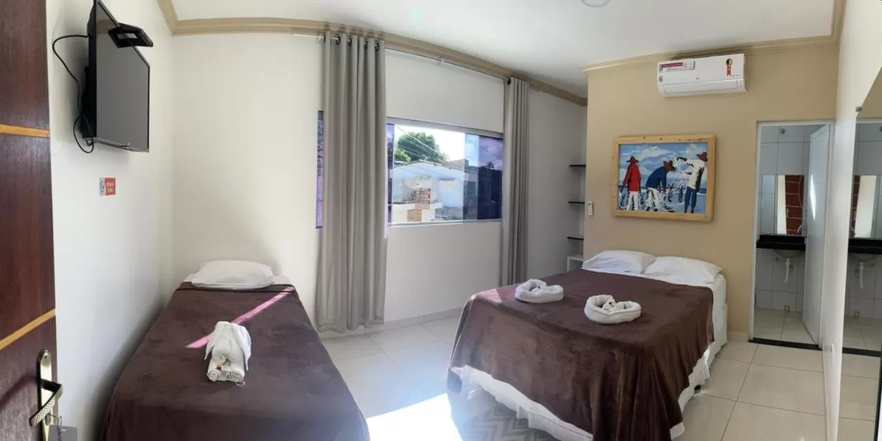 Bed in Pousada La Belle