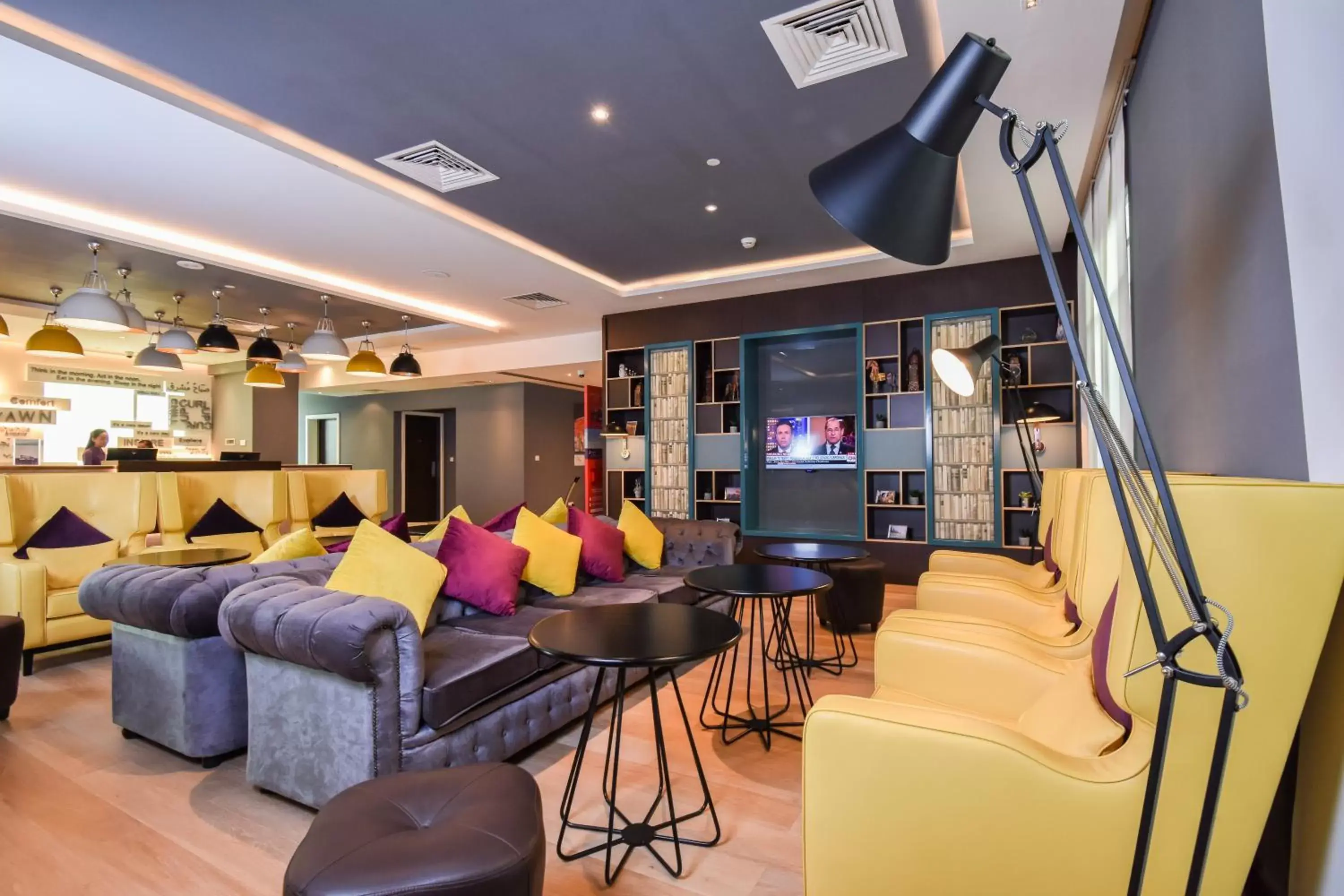 Communal lounge/ TV room, Lounge/Bar in Premier Inn Dubai Investments Park