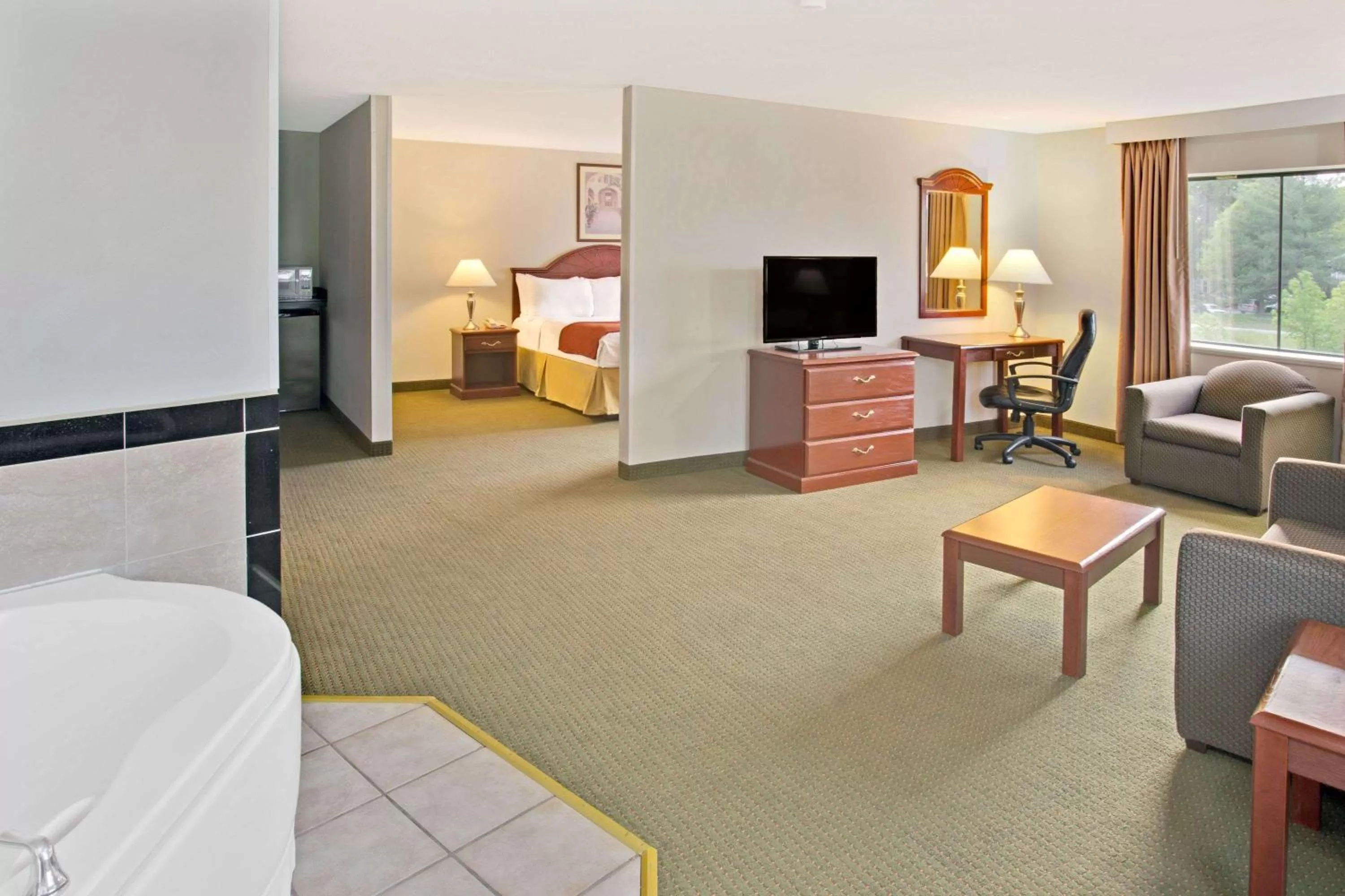 Photo of the whole room, Bed in Days Inn & Suites by Wyndham Laurel Near Fort Meade