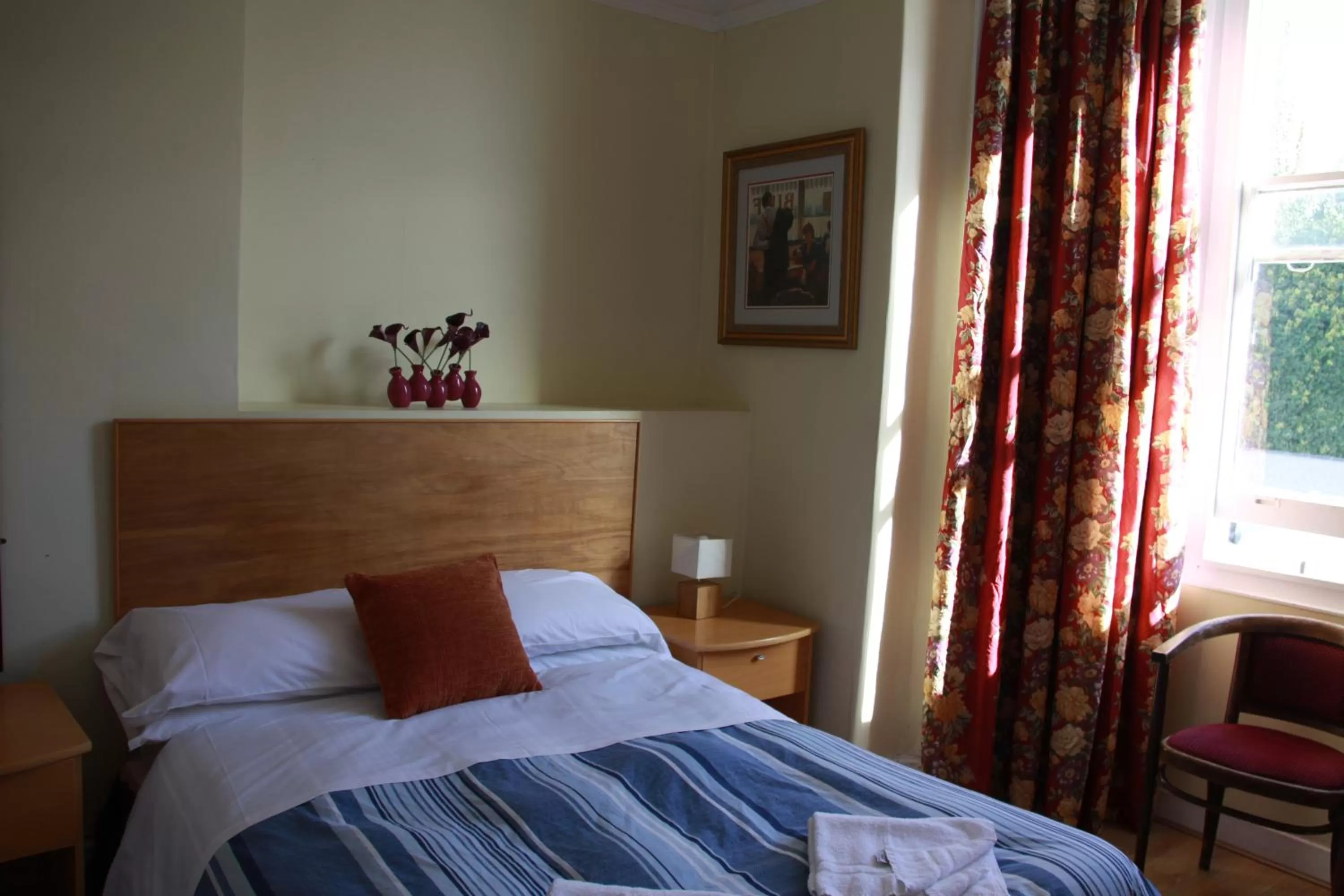 Bed in Ambassador Hotel