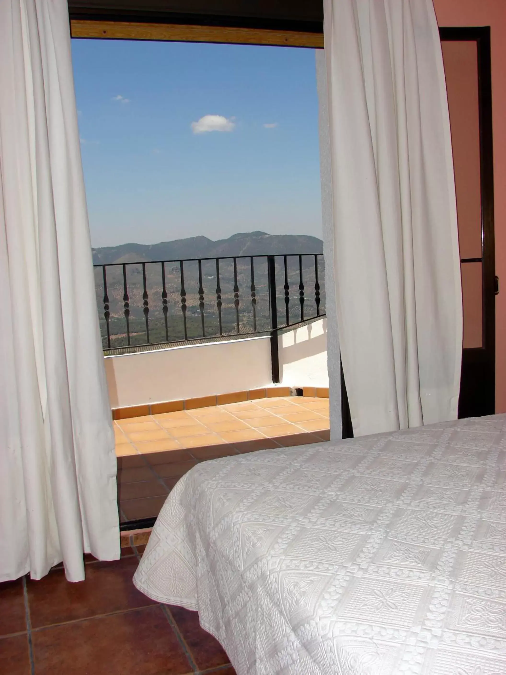 Balcony/Terrace, Bed in Apartamentos Sierra de Segura