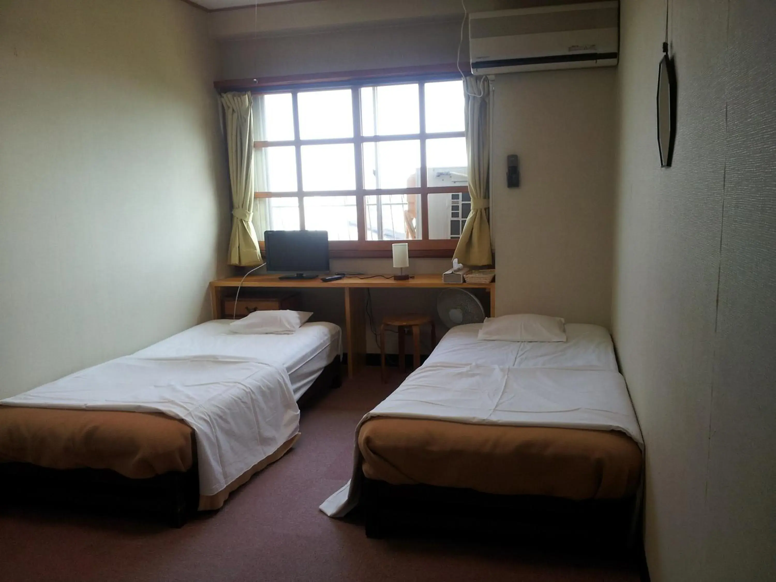 Bed in Orange Pension