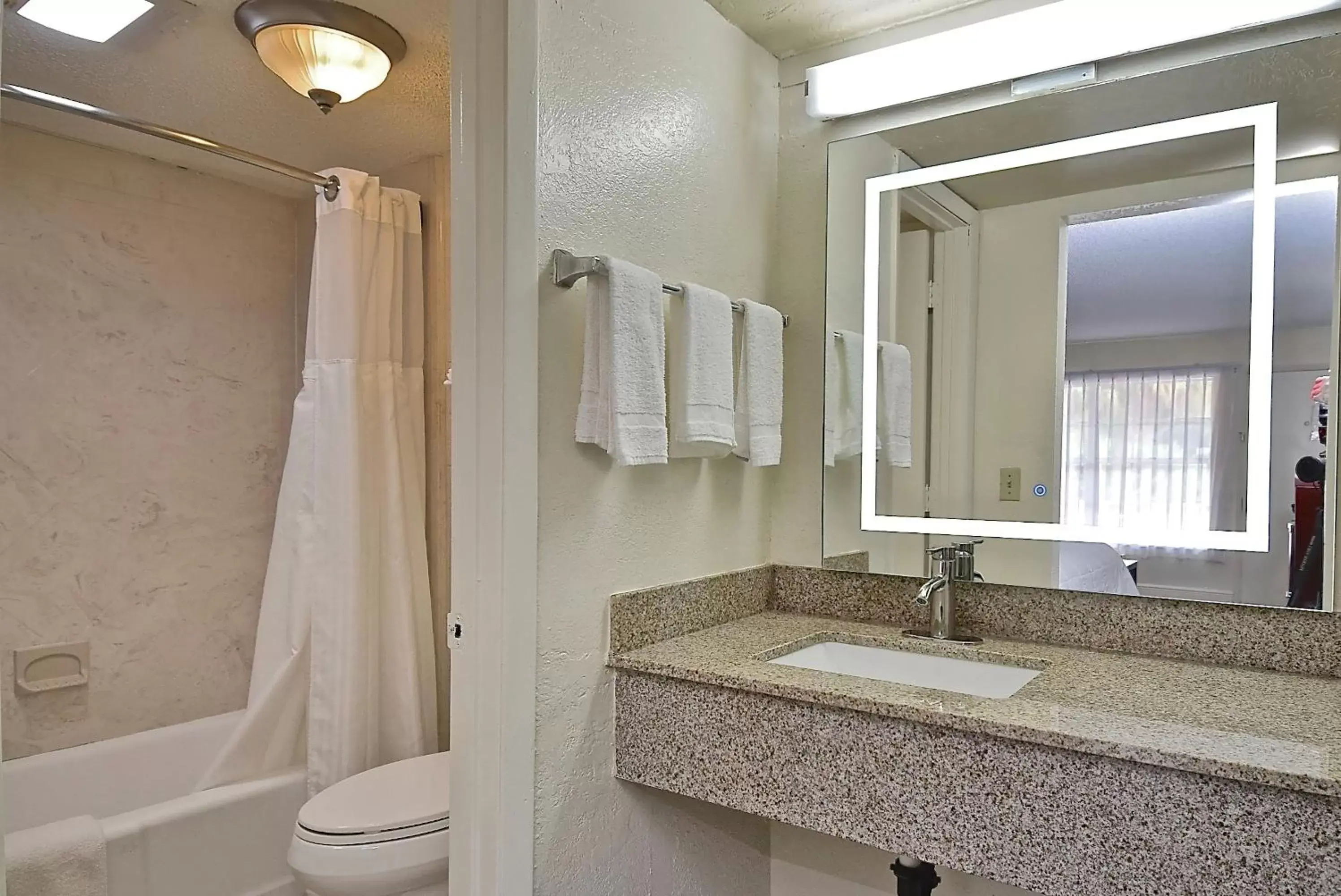 Bathroom in SureStay Hotel by Best Western Sarasota Lido Beach