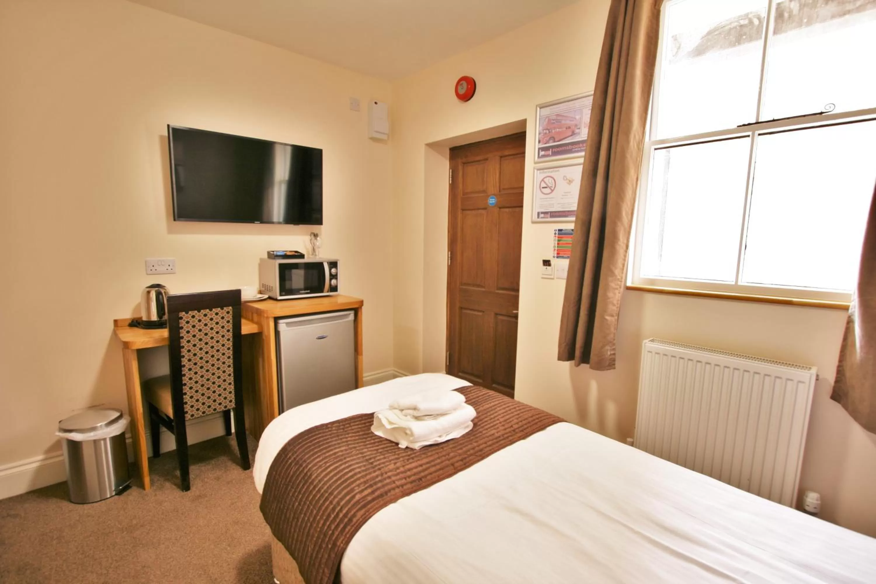 Bed in New County Hotel & Serviced Apartments by RoomsBooked