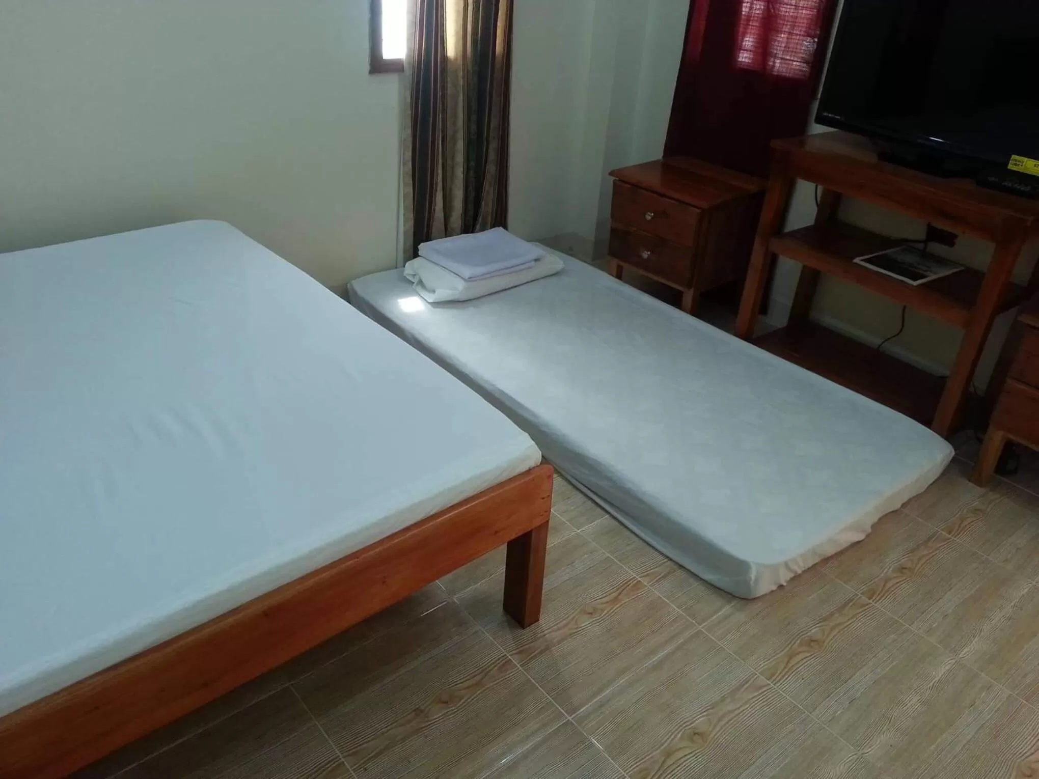 Bed in D's Oceanview Beach Resort