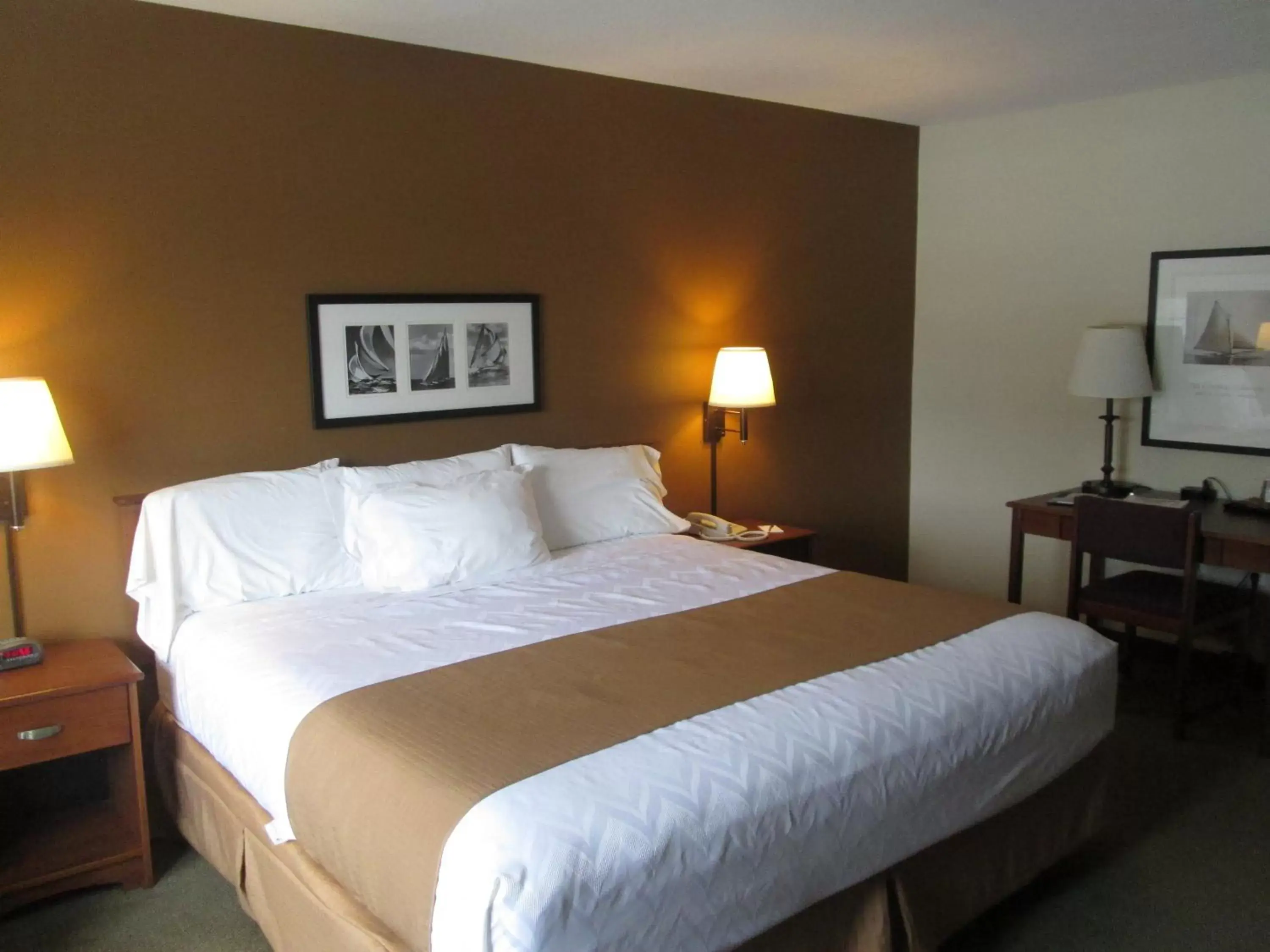 Bed in AmericInn by Wyndham Charlevoix