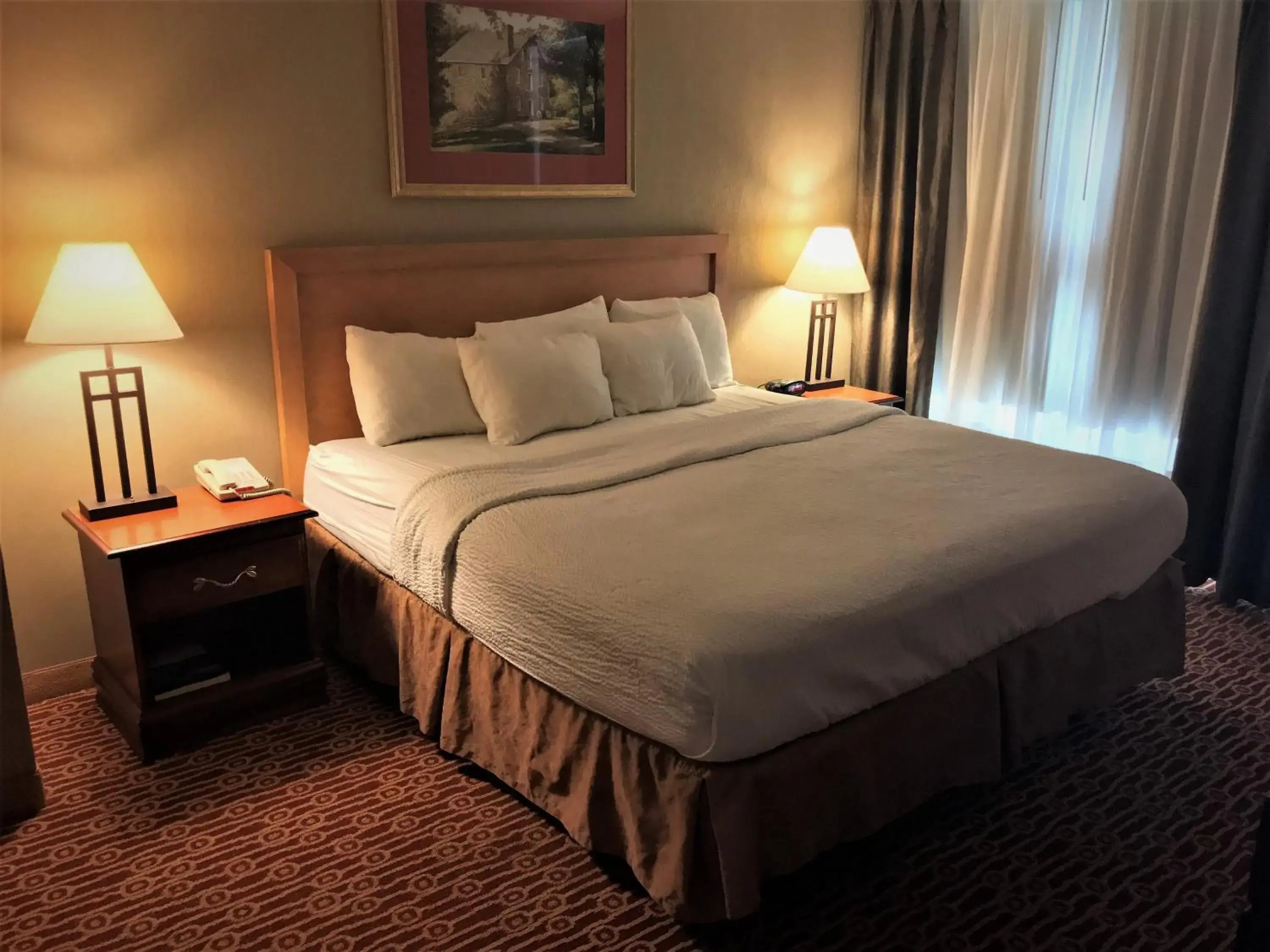 Photo of the whole room, Bed in Host Inn an All Suites Hotel