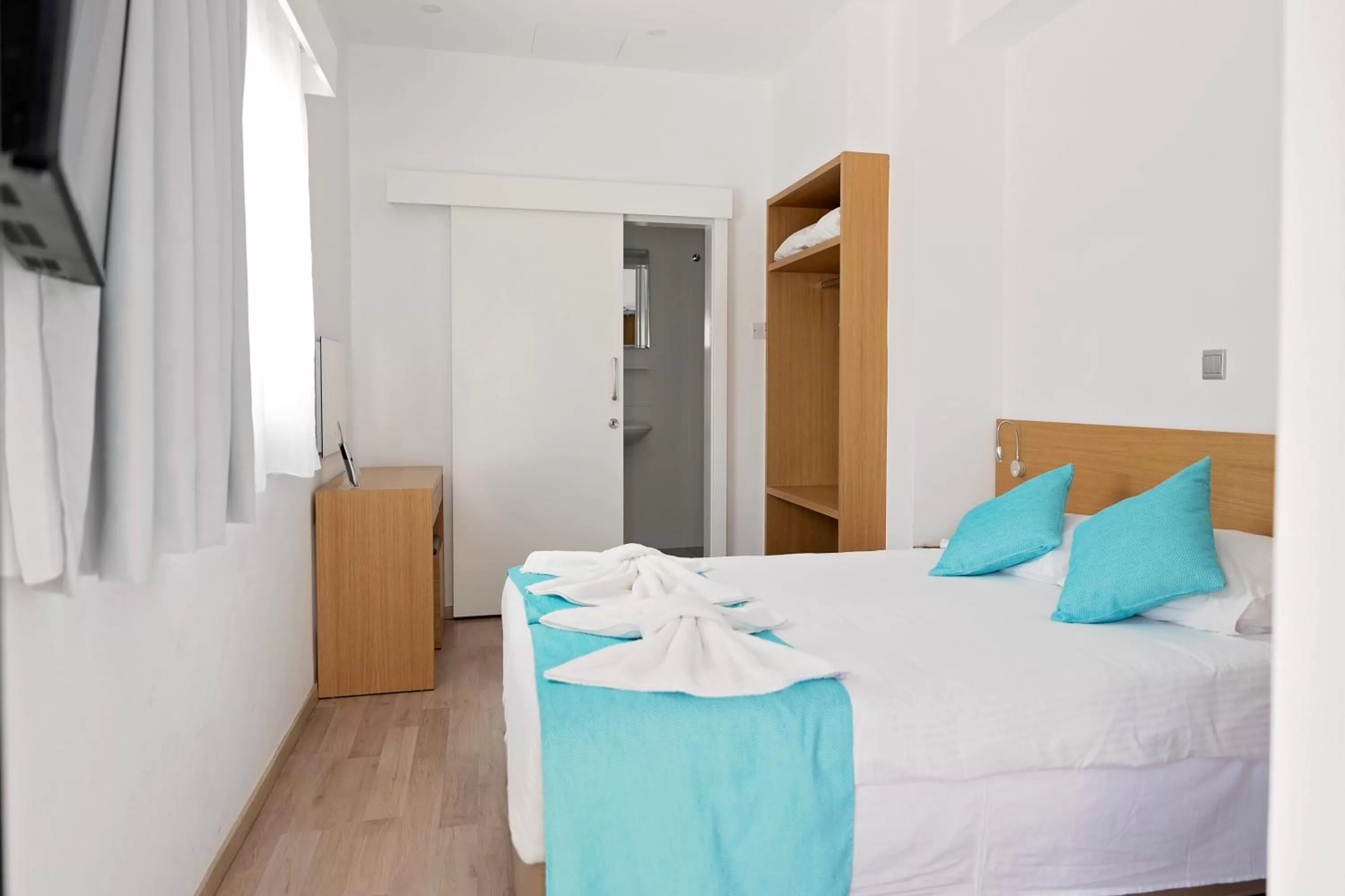 Bed in Pyramos Hotel