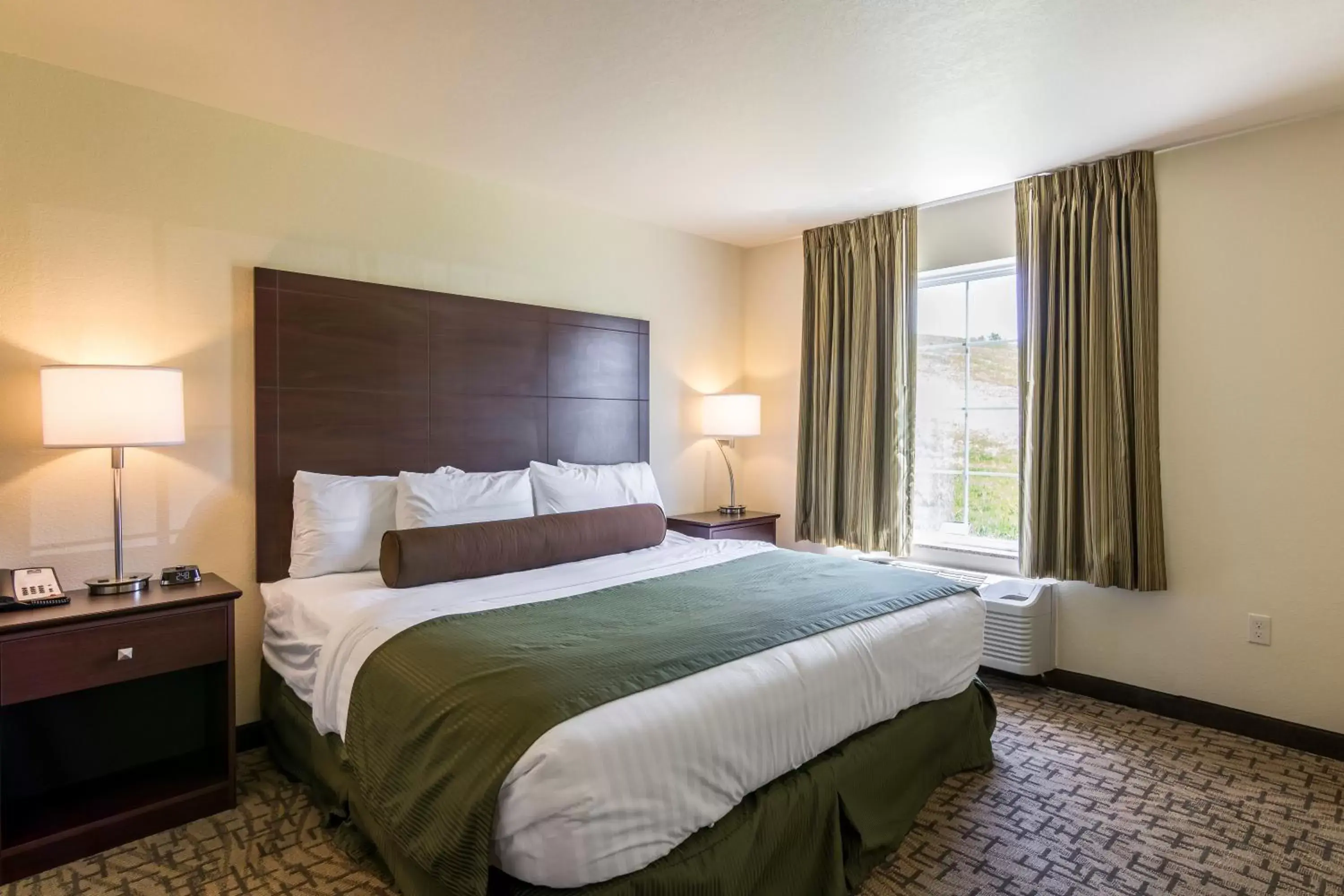 Bed in Cobblestone Inn & Suites - Barron