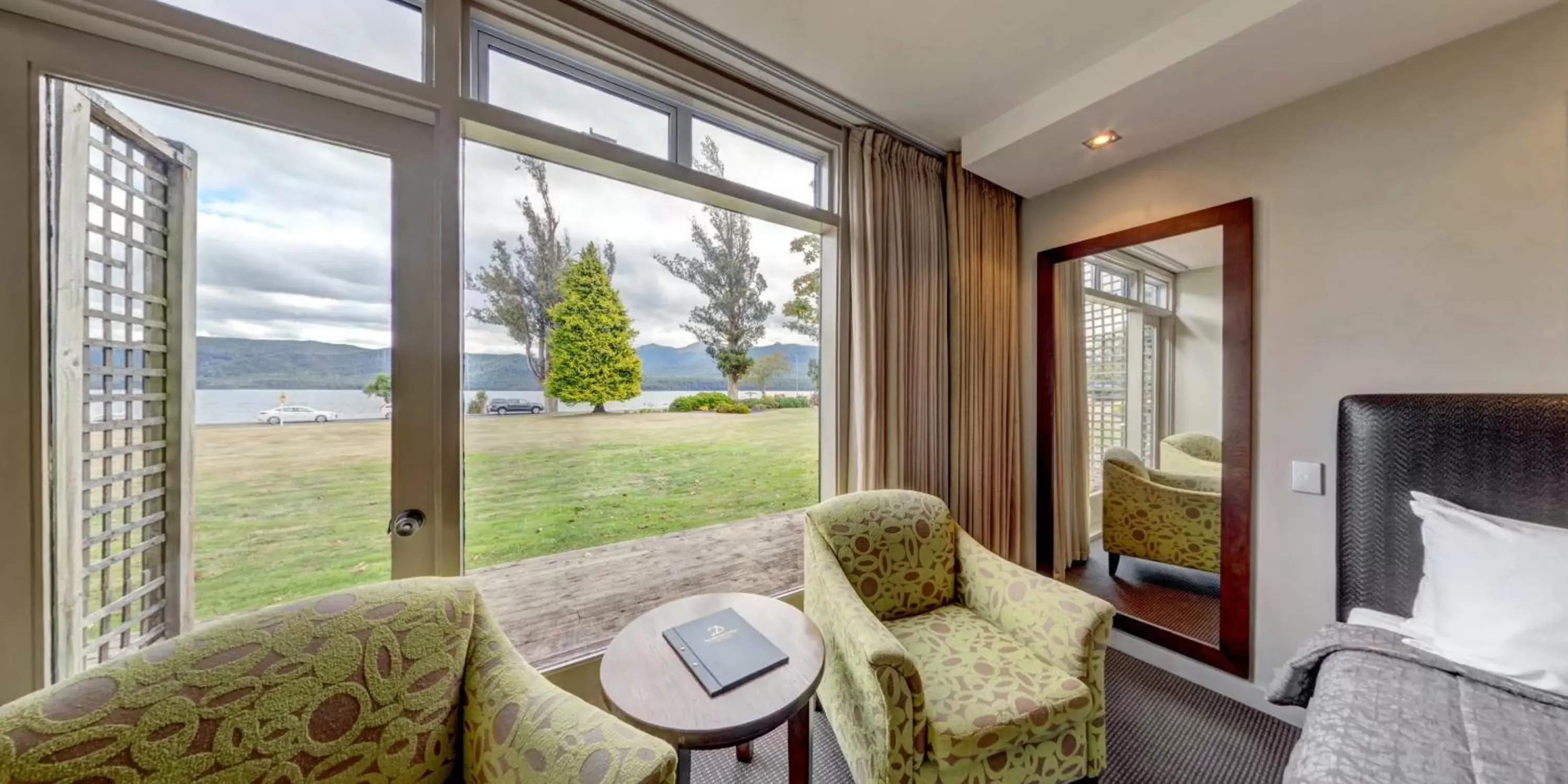 Bed, Seating Area in Distinction Te Anau Hotel & Villas