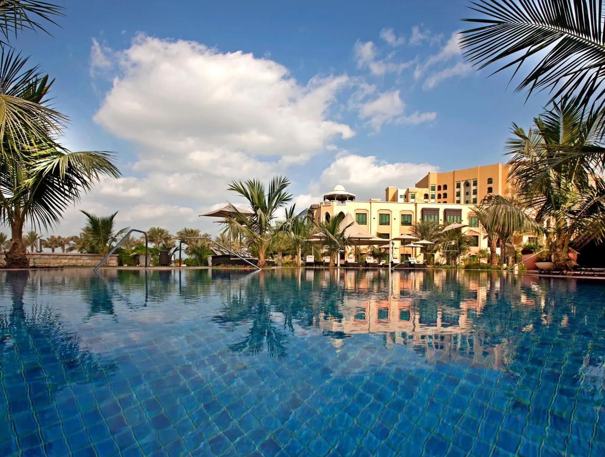 Property building, Swimming Pool in Shangri-La Hotel Apartments Qaryat Al Beri