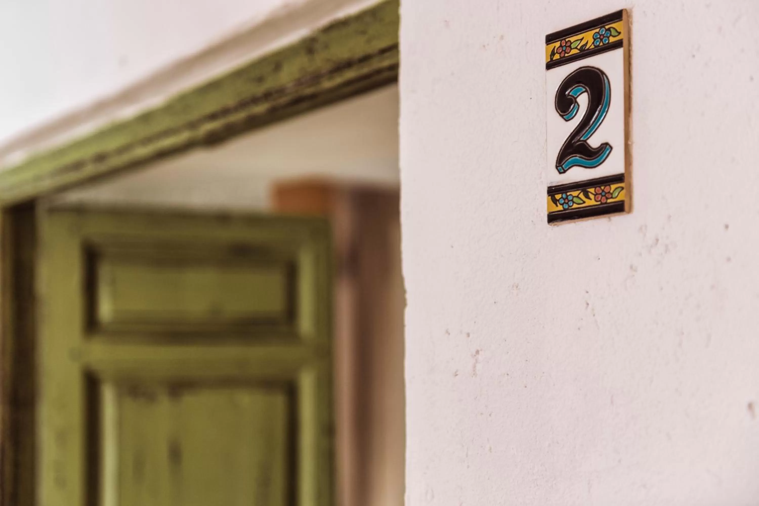 Property logo or sign in Encanto Guesthouse