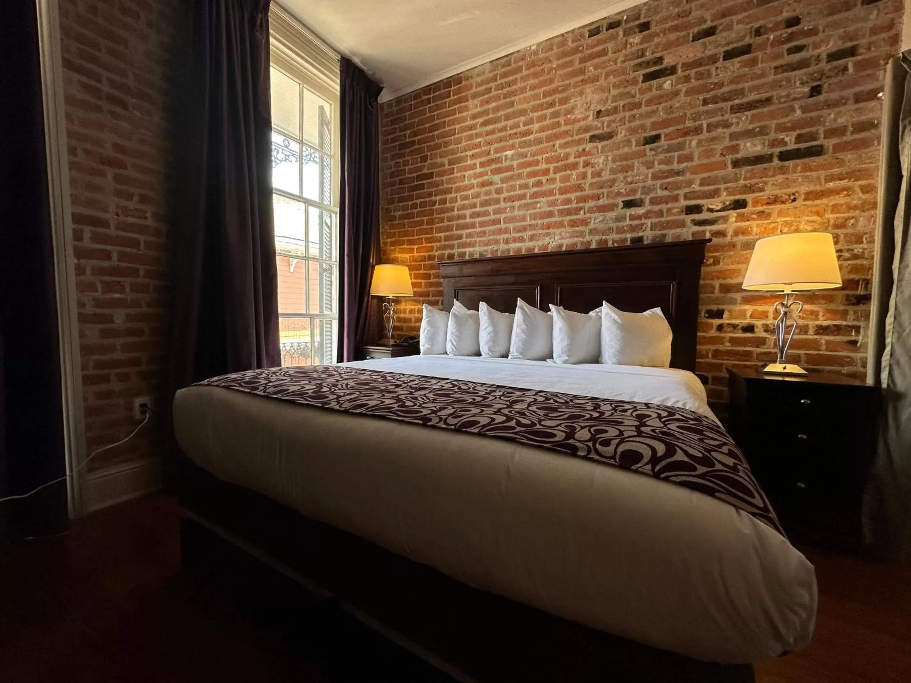 Bed in Inn on St. Peter, a French Quarter Guest Houses Property