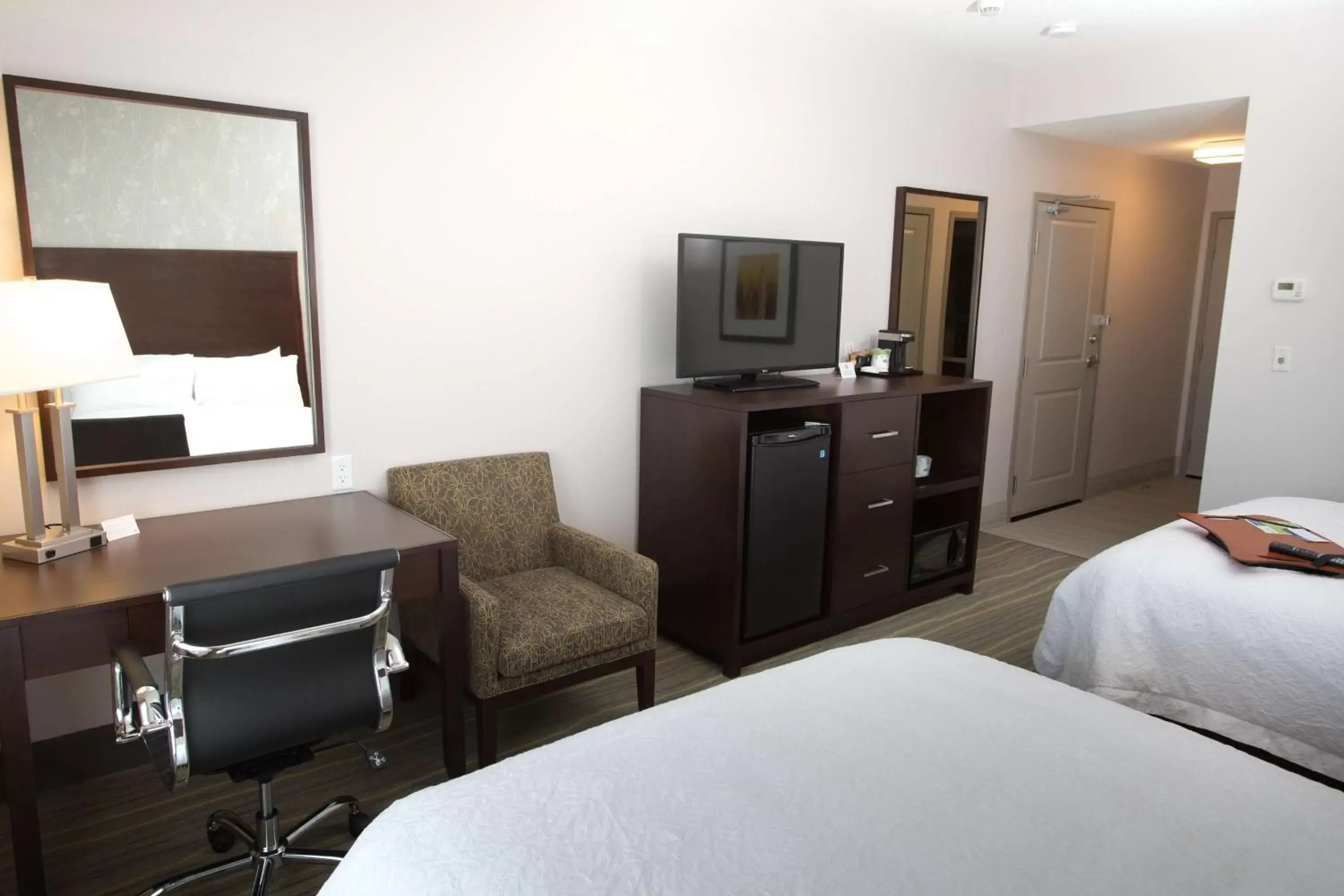 Bed, TV/Entertainment Center in Hampton Inn by Hilton Lloydminster