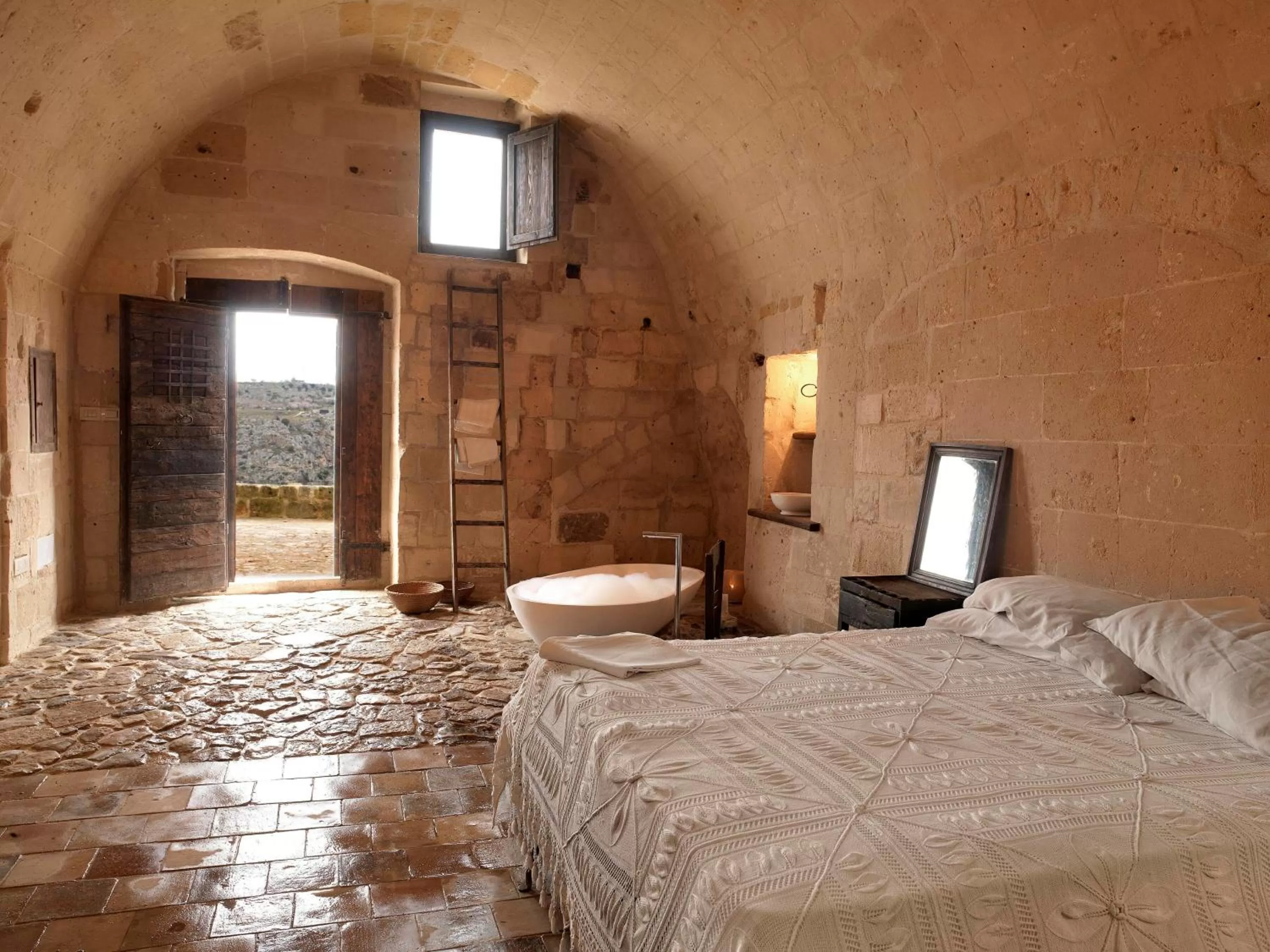 Photo of the whole room, Bed in Sextantio Le Grotte Della Civita