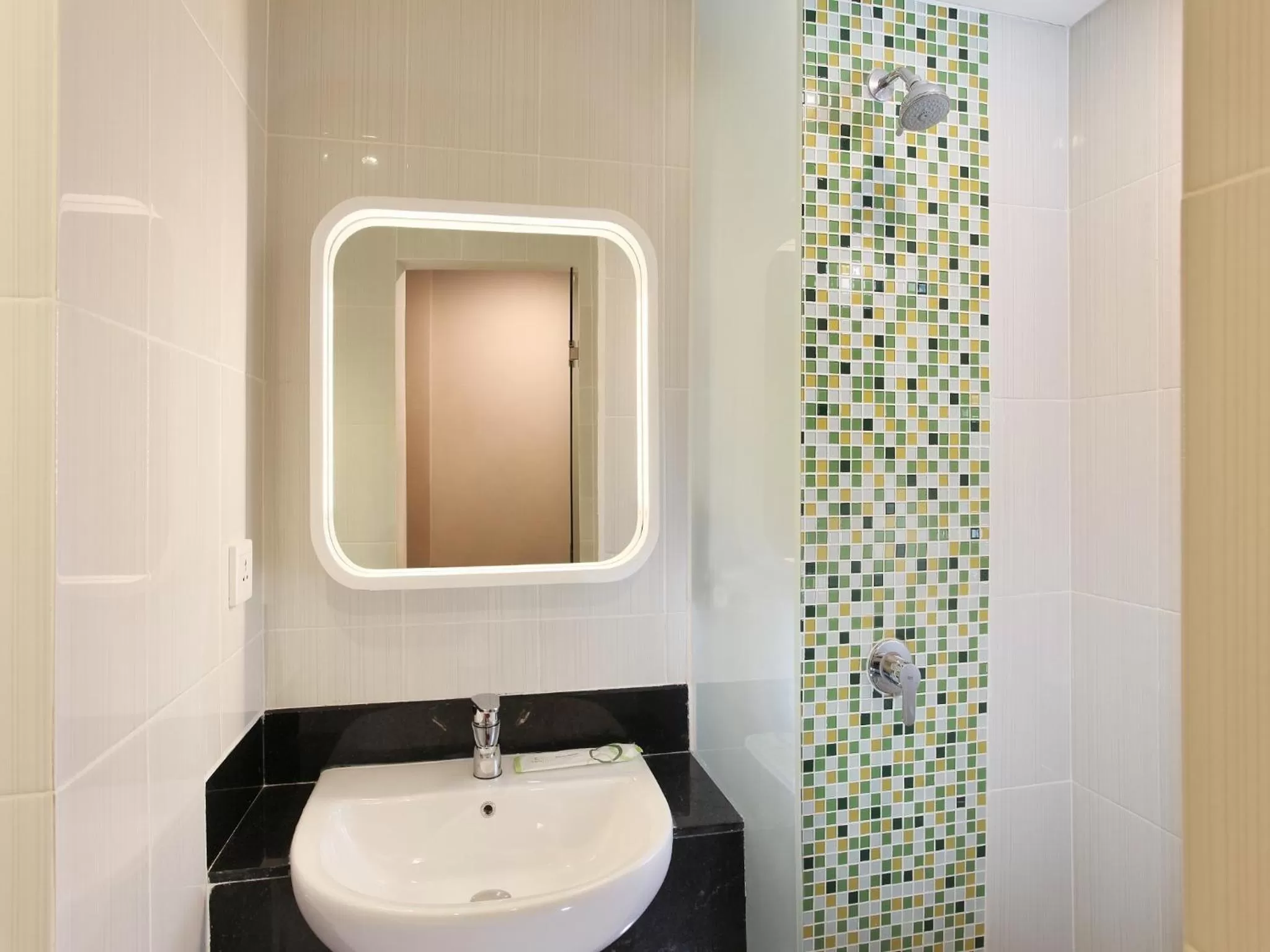 Bathroom in Zest Airport Jakarta by Swiss-Belhotel International