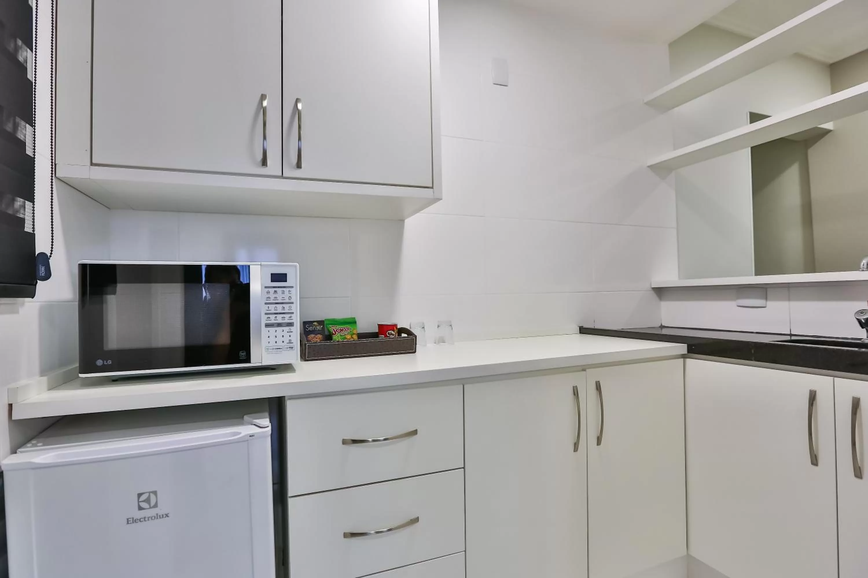 Kitchen or kitchenette in Wyndham Golden Foz Suítes