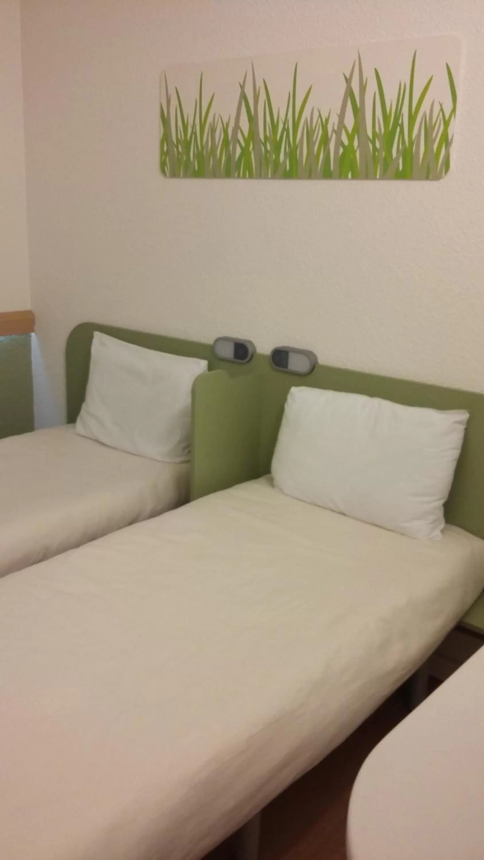 Decorative detail, Bed in Ibis Budget Montbéliard