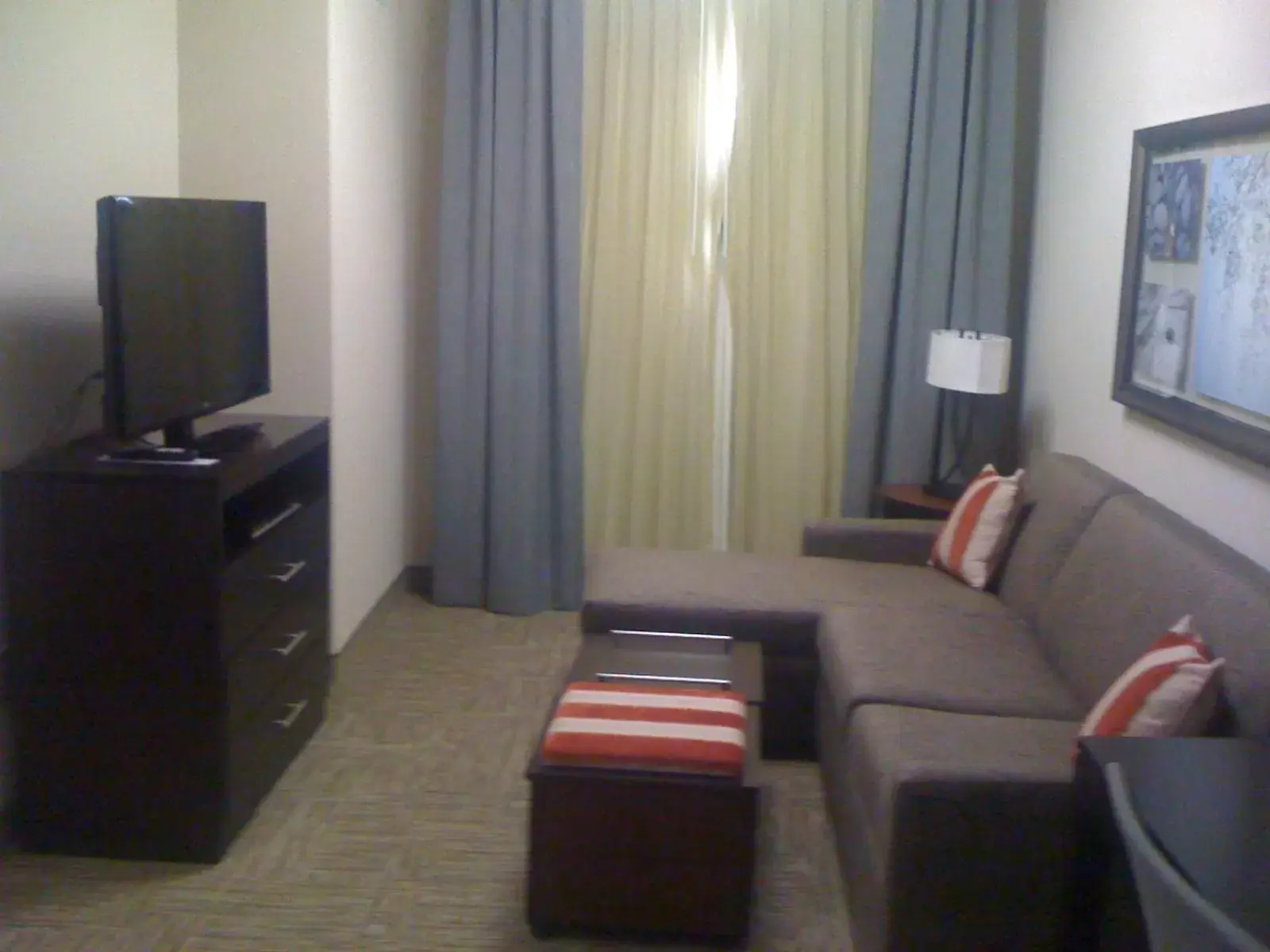Communal lounge/ TV room, TV/Entertainment Center in Staybridge Suites Houston Stafford - Sugar Land, an IHG Hotel