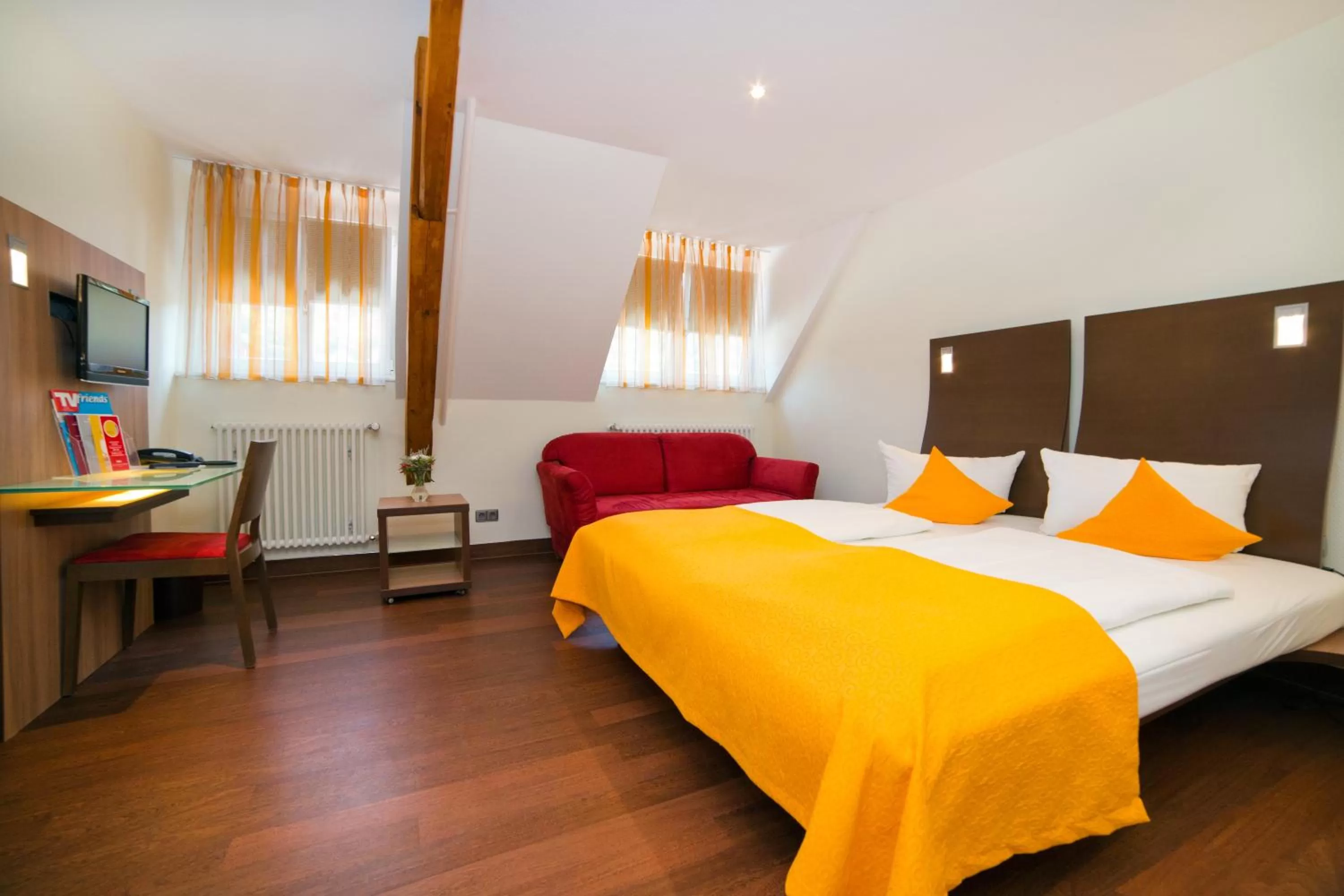 Photo of the whole room, Bed in Stadthotel Freiburg Kolping Hotels & Resorts