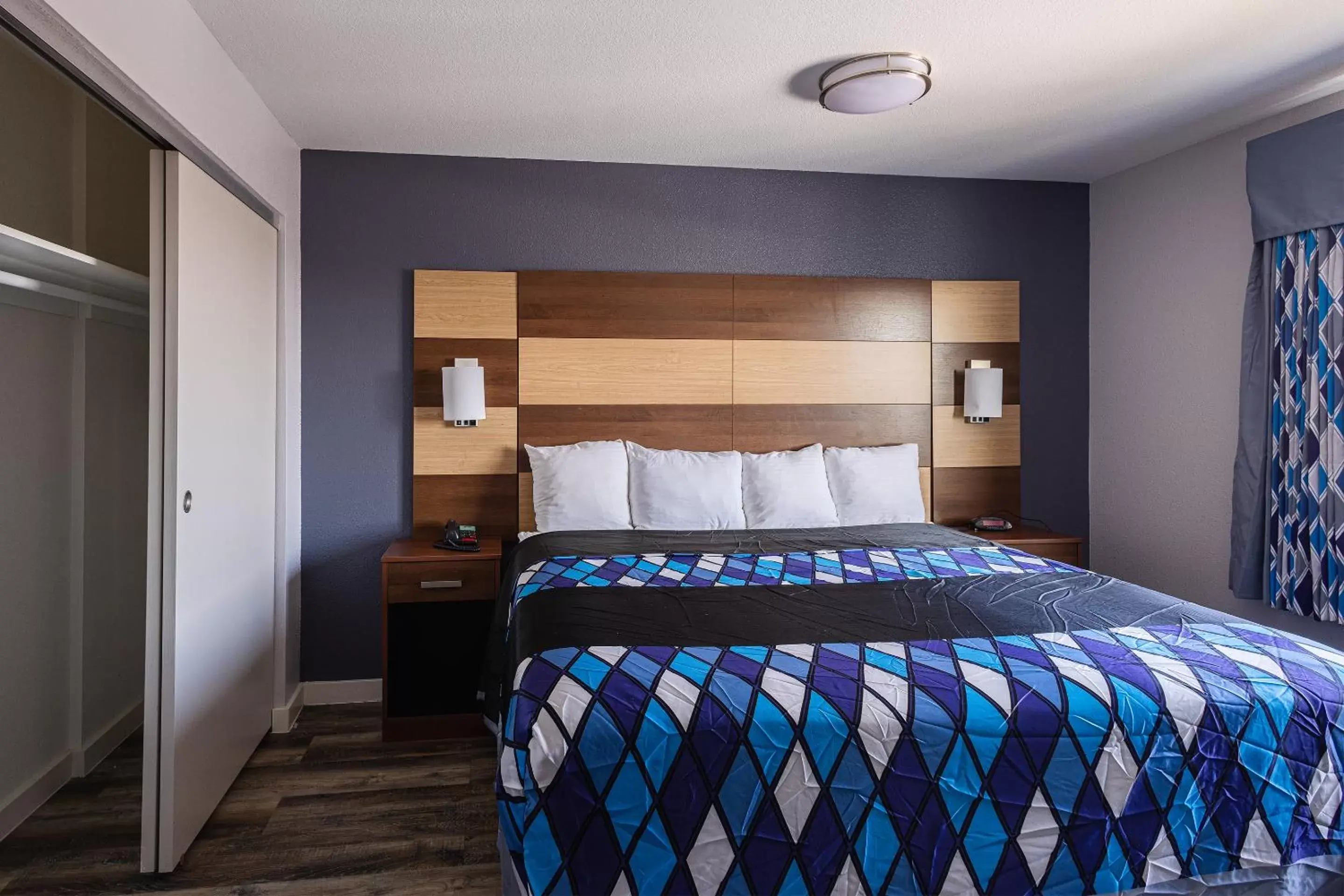 Bed in Coratel Inn & Suites by Jasper Inver Grove Heights