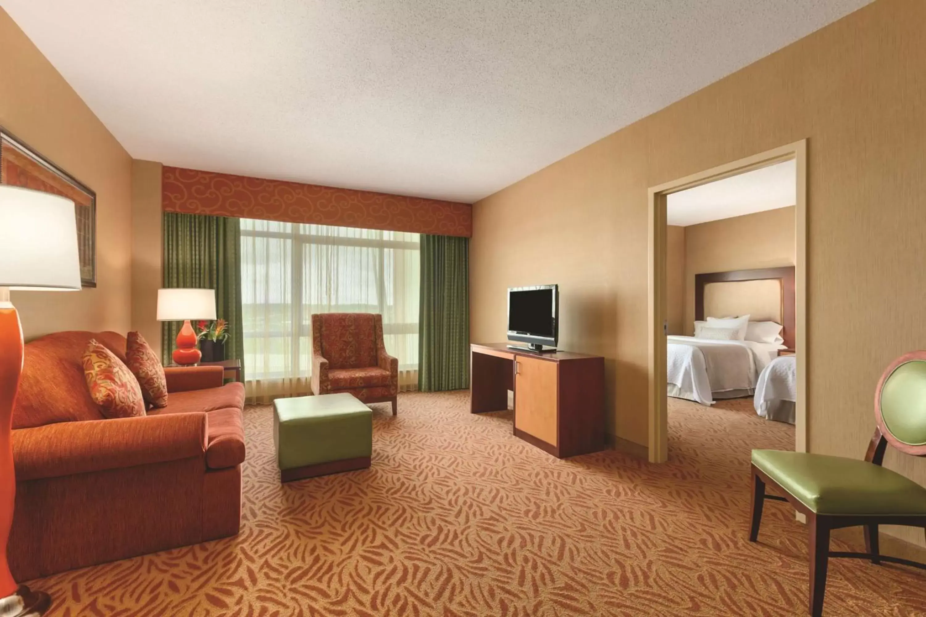 Bedroom, Seating Area in Embassy Suites Omaha- La Vista/ Hotel & Conference Center