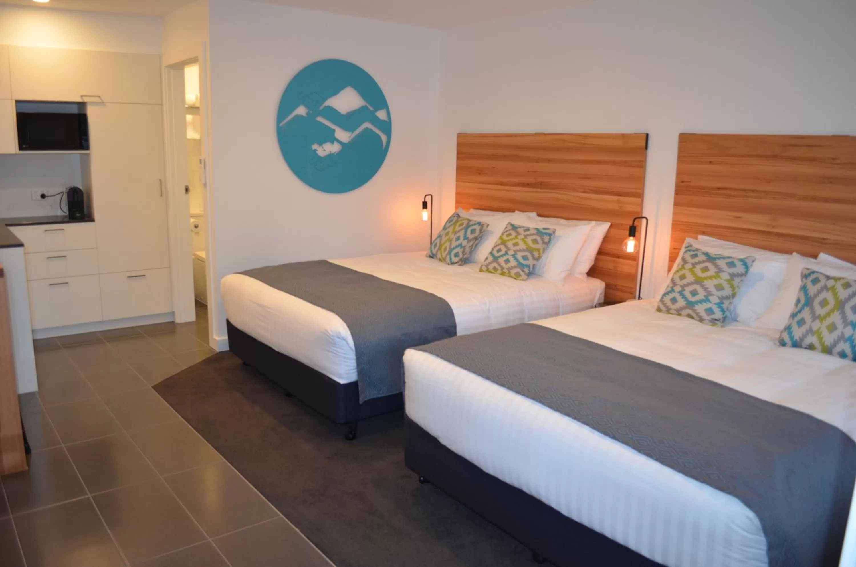 Bed in Bright Colonial Motel