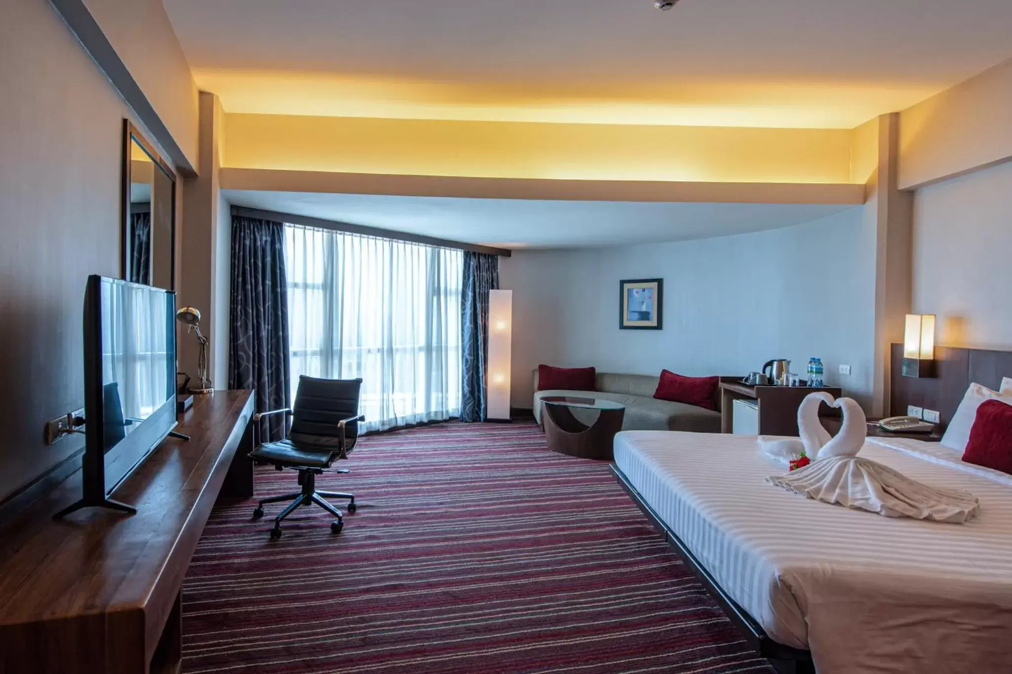 Bed, TV/Entertainment Center in Ambassador Hotel Bangkok - SHA Extra Plus