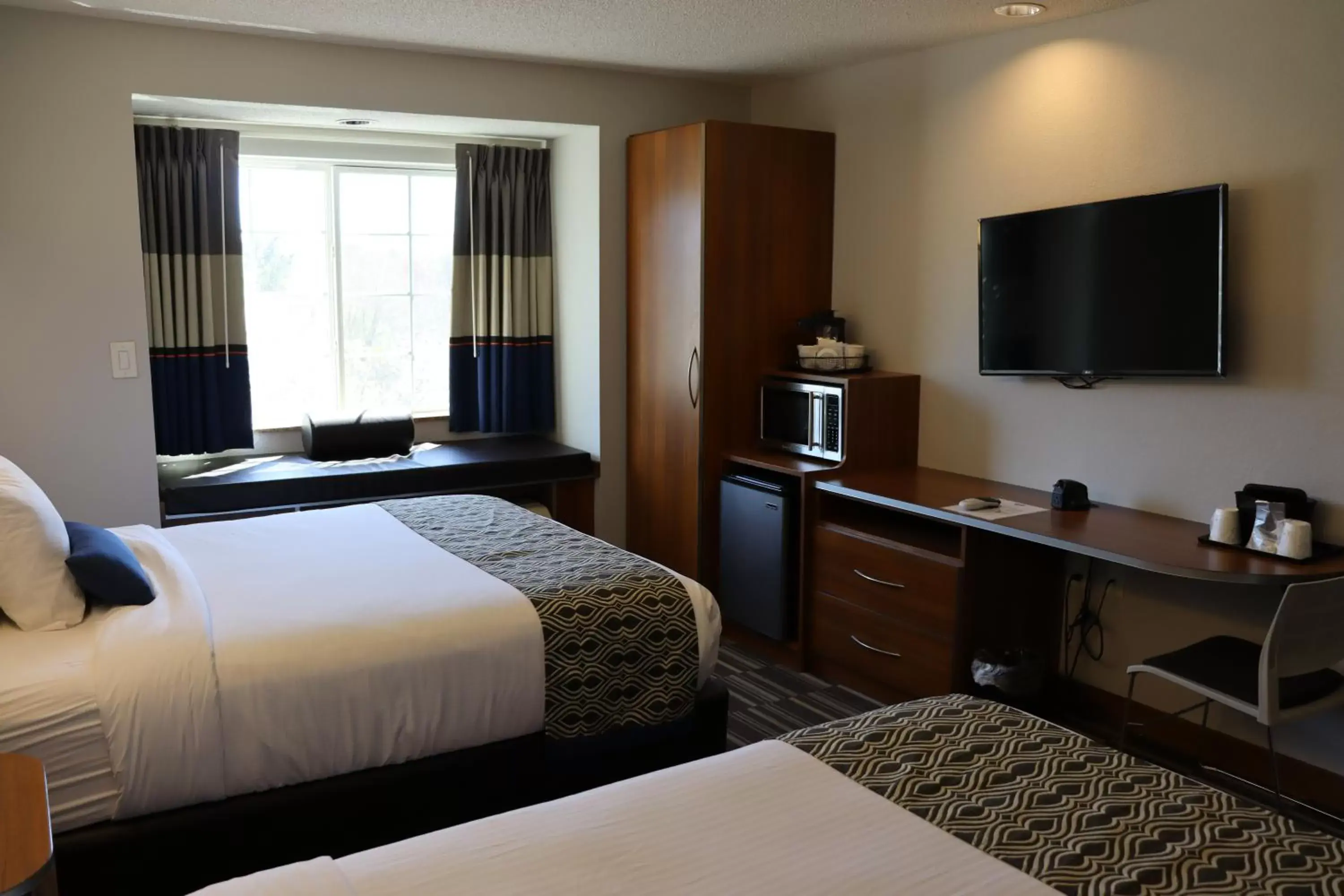 Bed in Microtel Inn & Suites by Wyndham Columbus Near Fort Moore