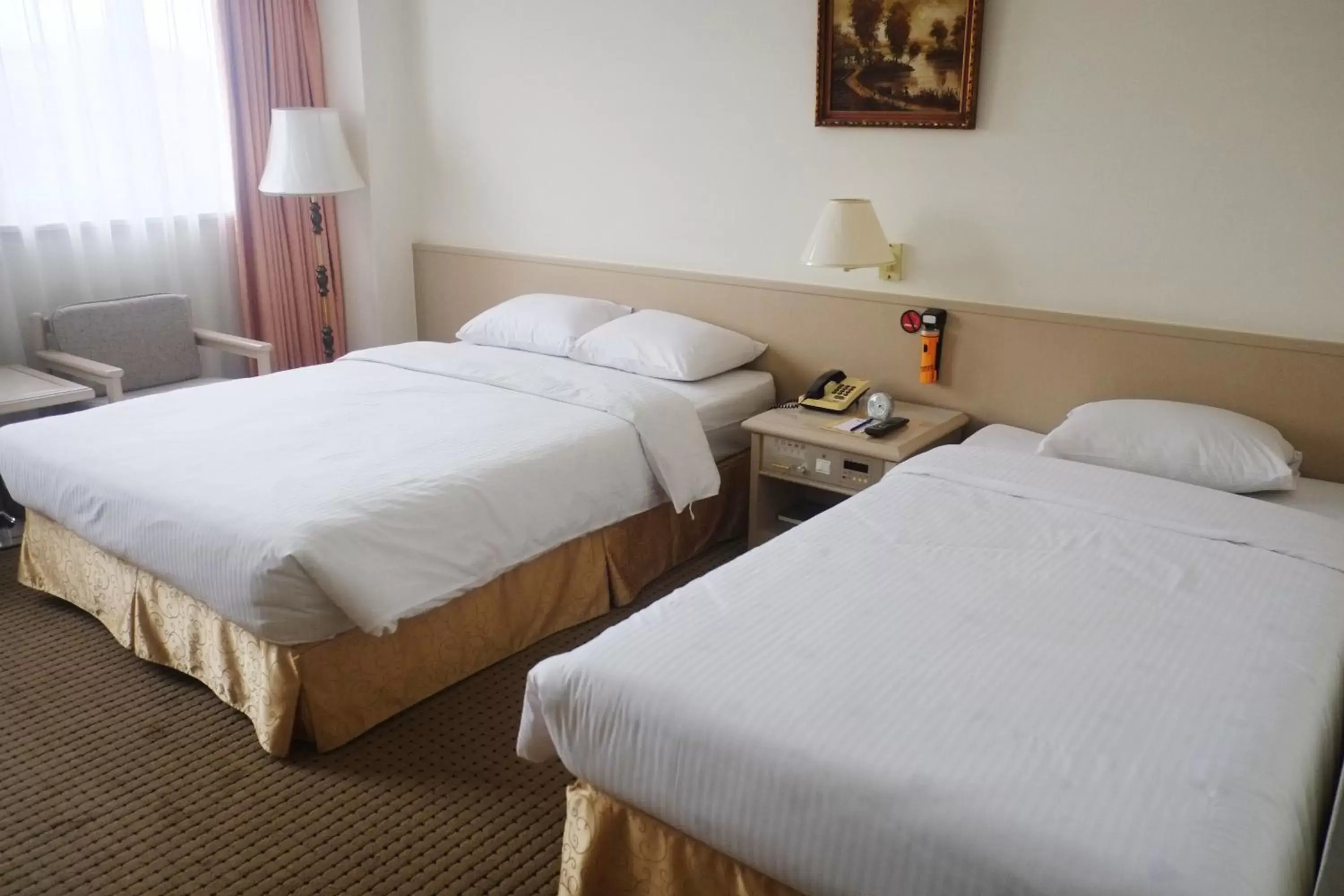 Bed in Emperor Hotel