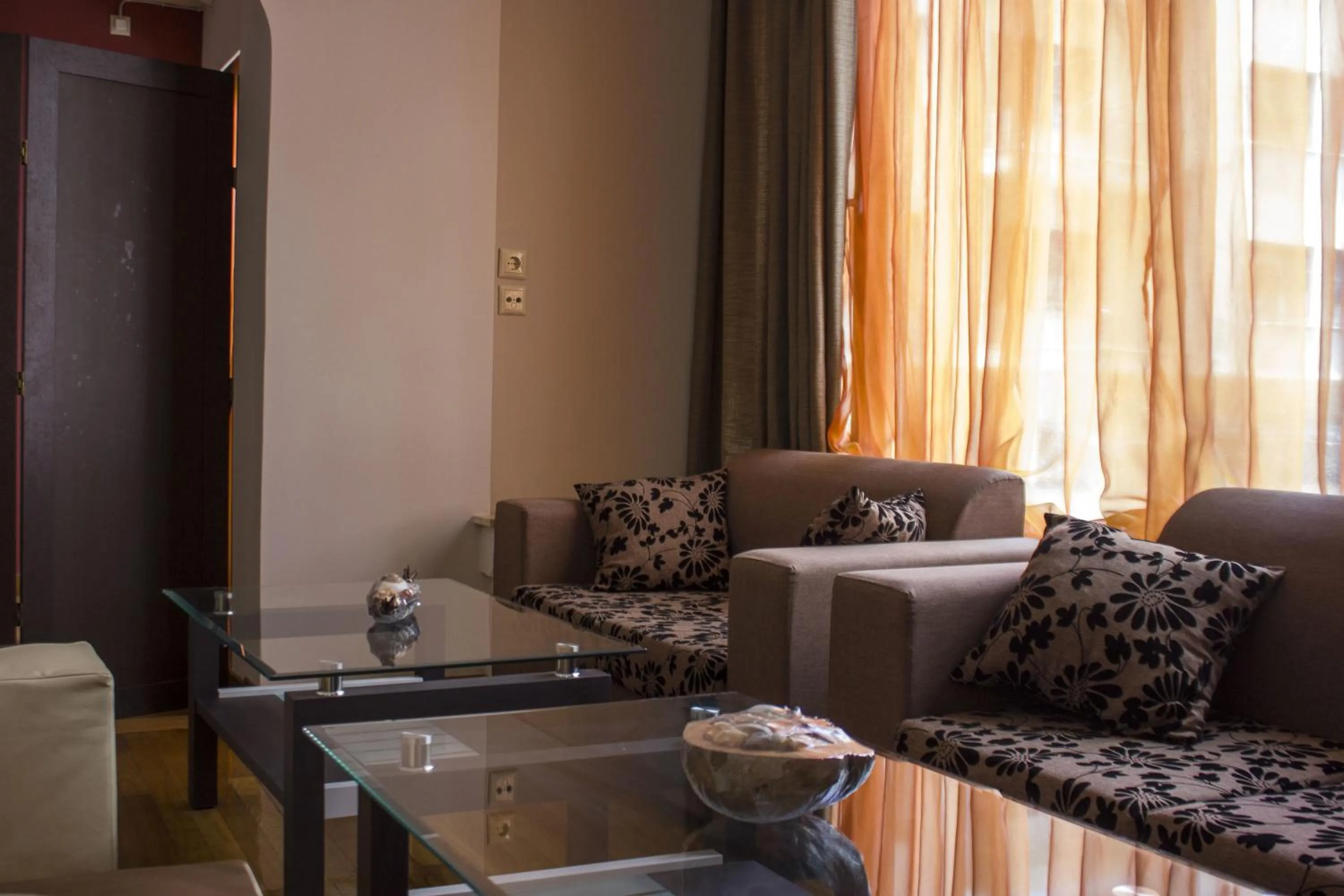 Communal lounge/ TV room in Ambrosia Suites