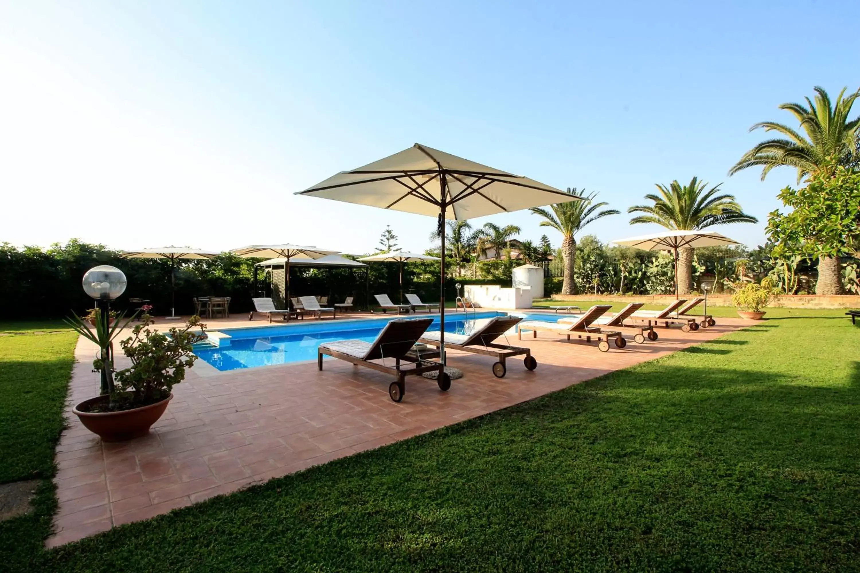 Swimming pool, Garden in Villa Carlotta Resort