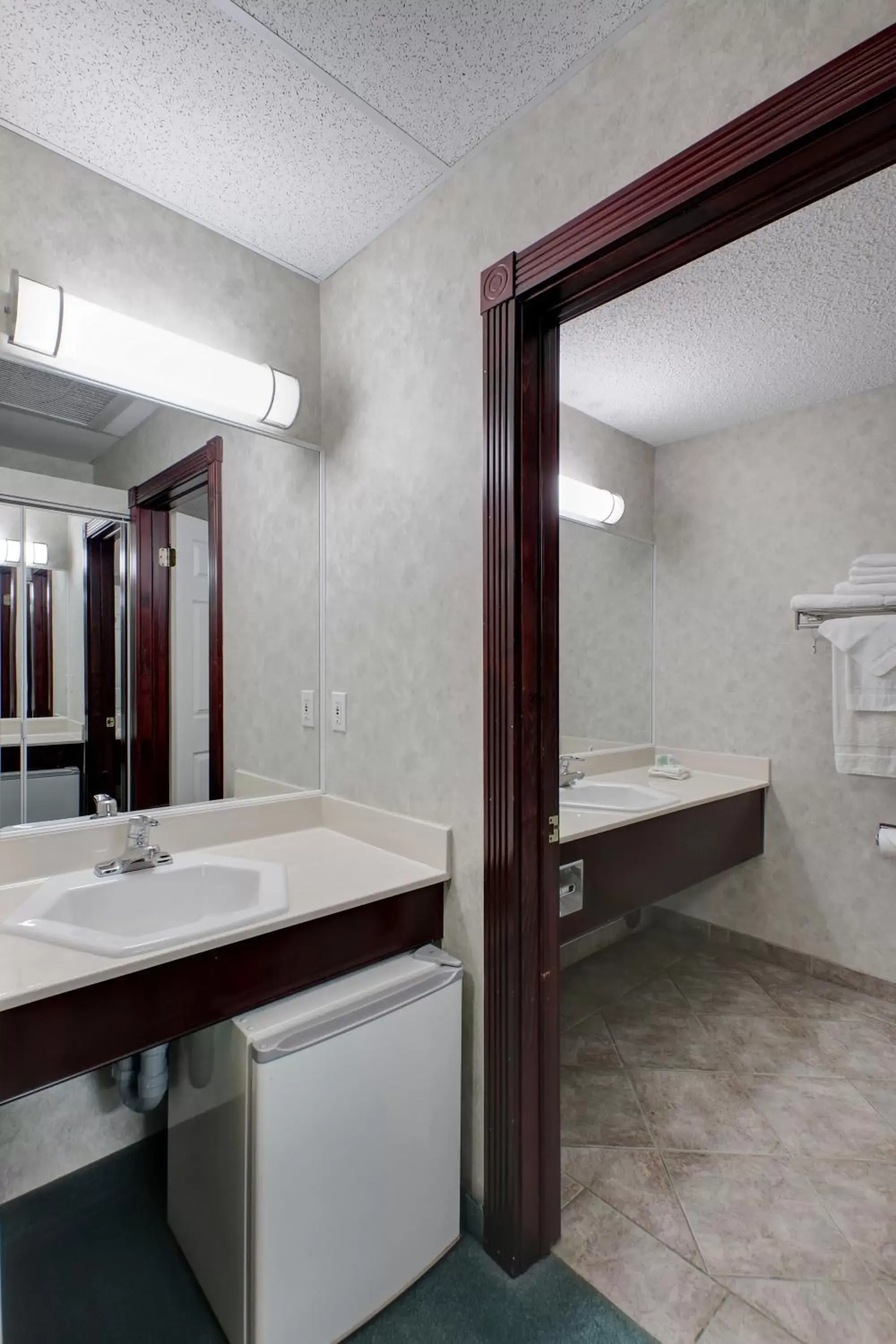 Bathroom in Ramada by Wyndham Nisku Edmonton Airport