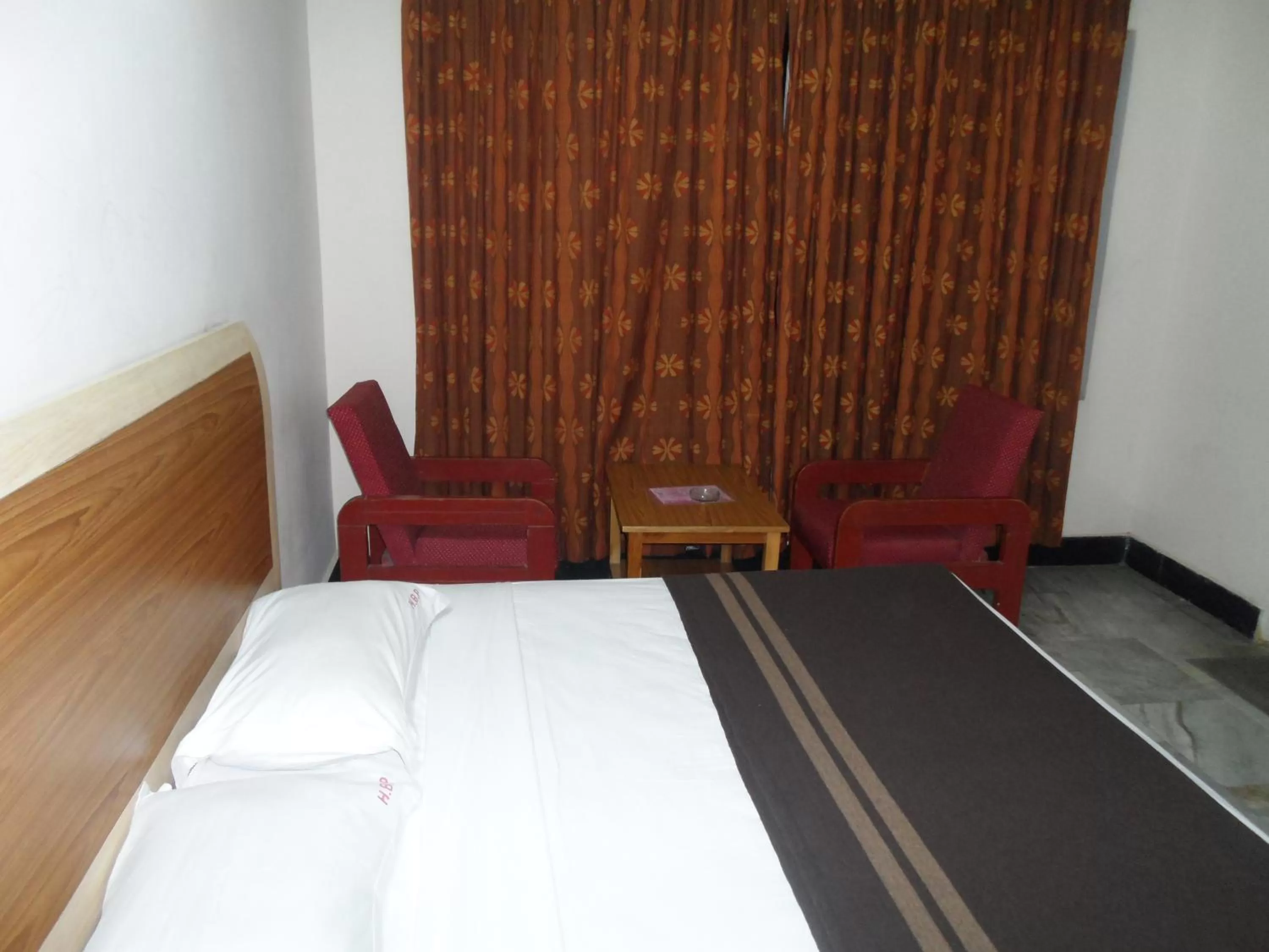 Bed in Hotel Bhimas Paradise