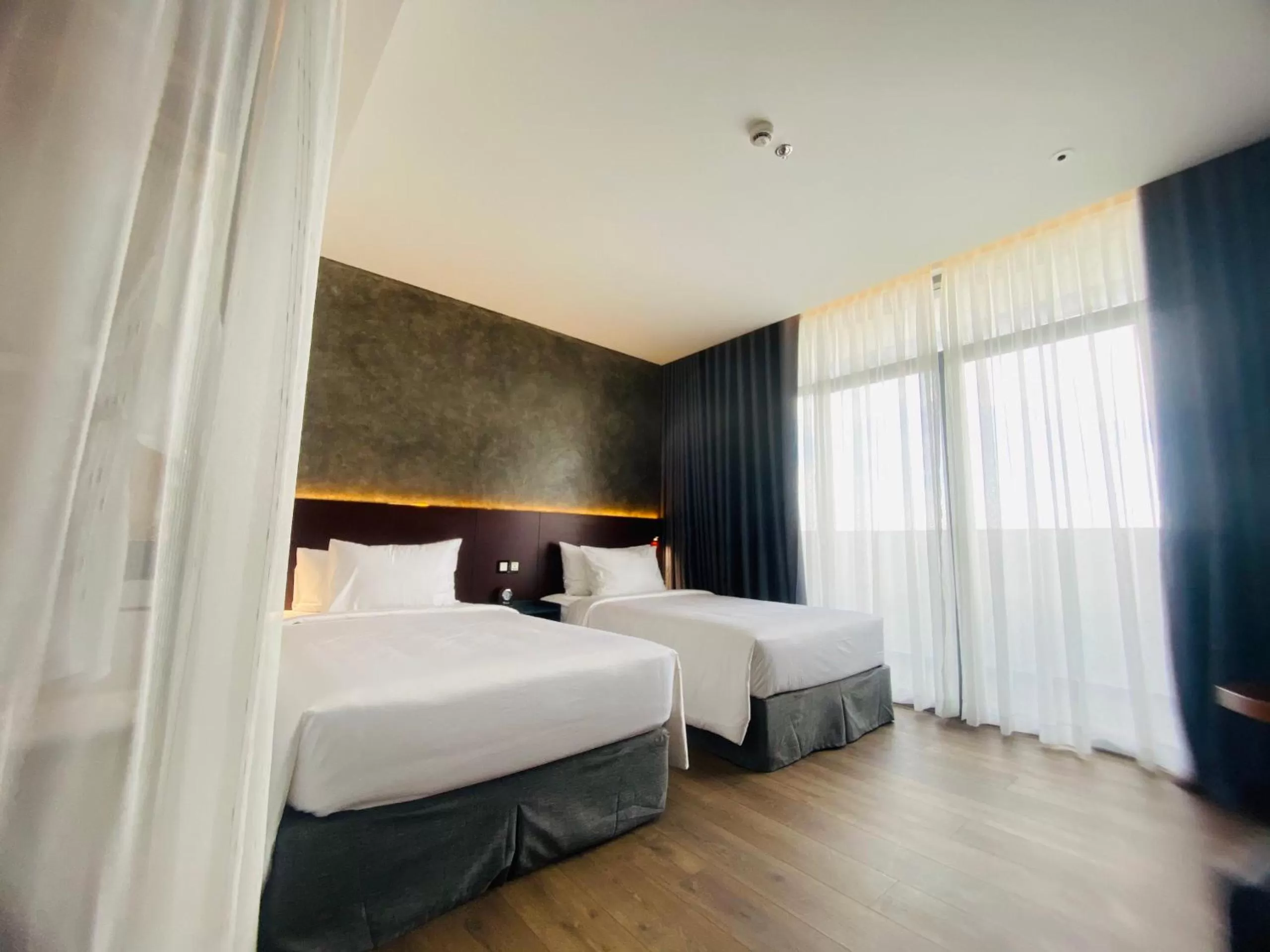 Bed in NEWCC HOTEL AND SERVICED APARTMENT