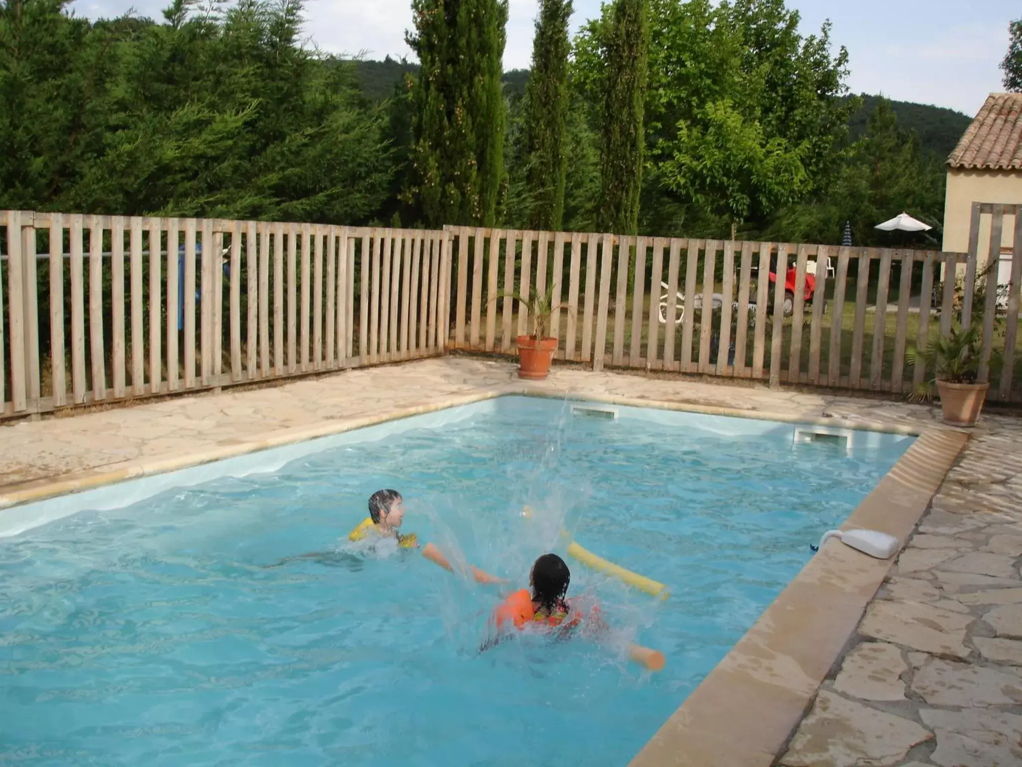 Swimming Pool in Chambres d'Hôtes Aux Tournesols
