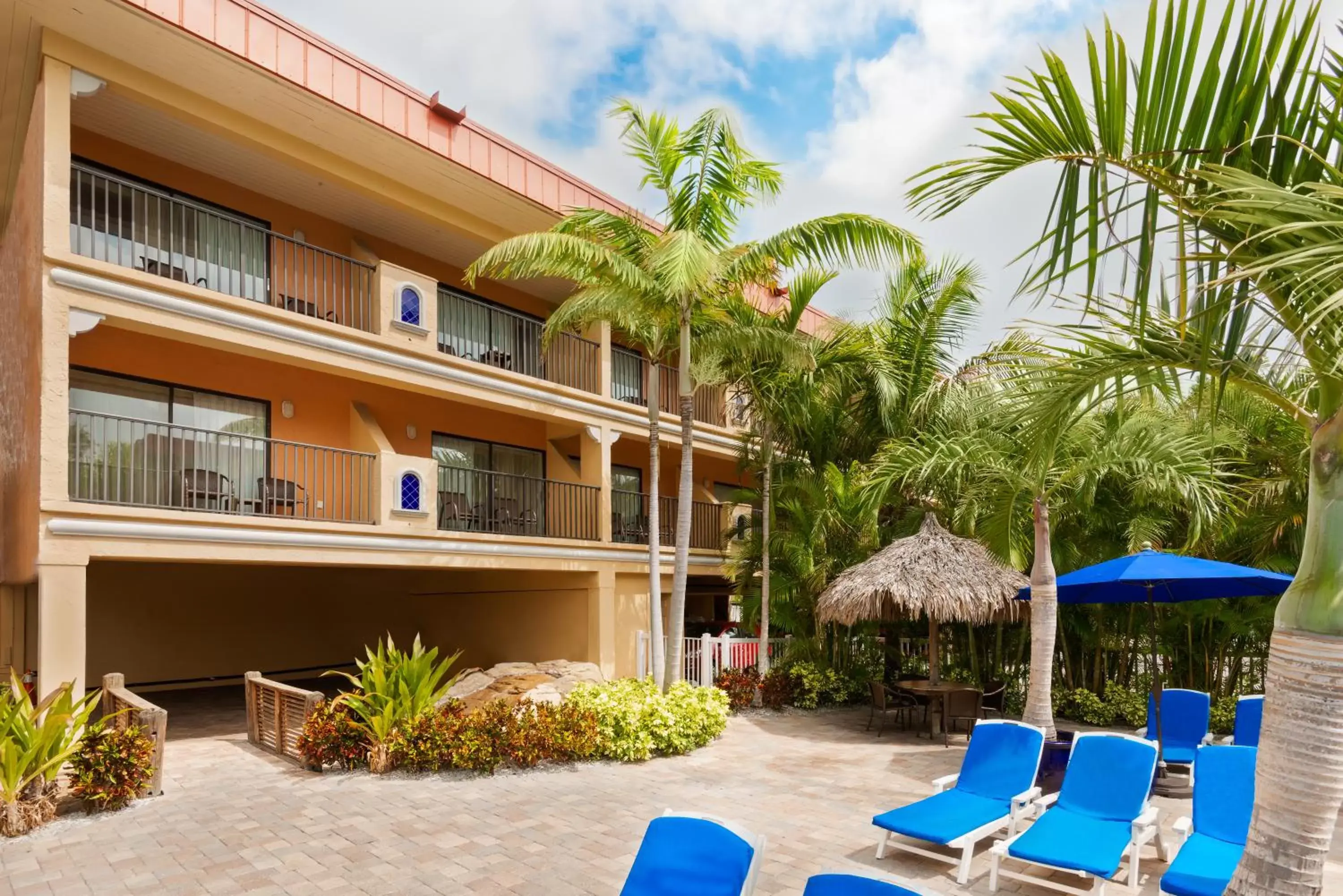 Swimming pool, Property Building in Coconut Cove All Suite Hotel