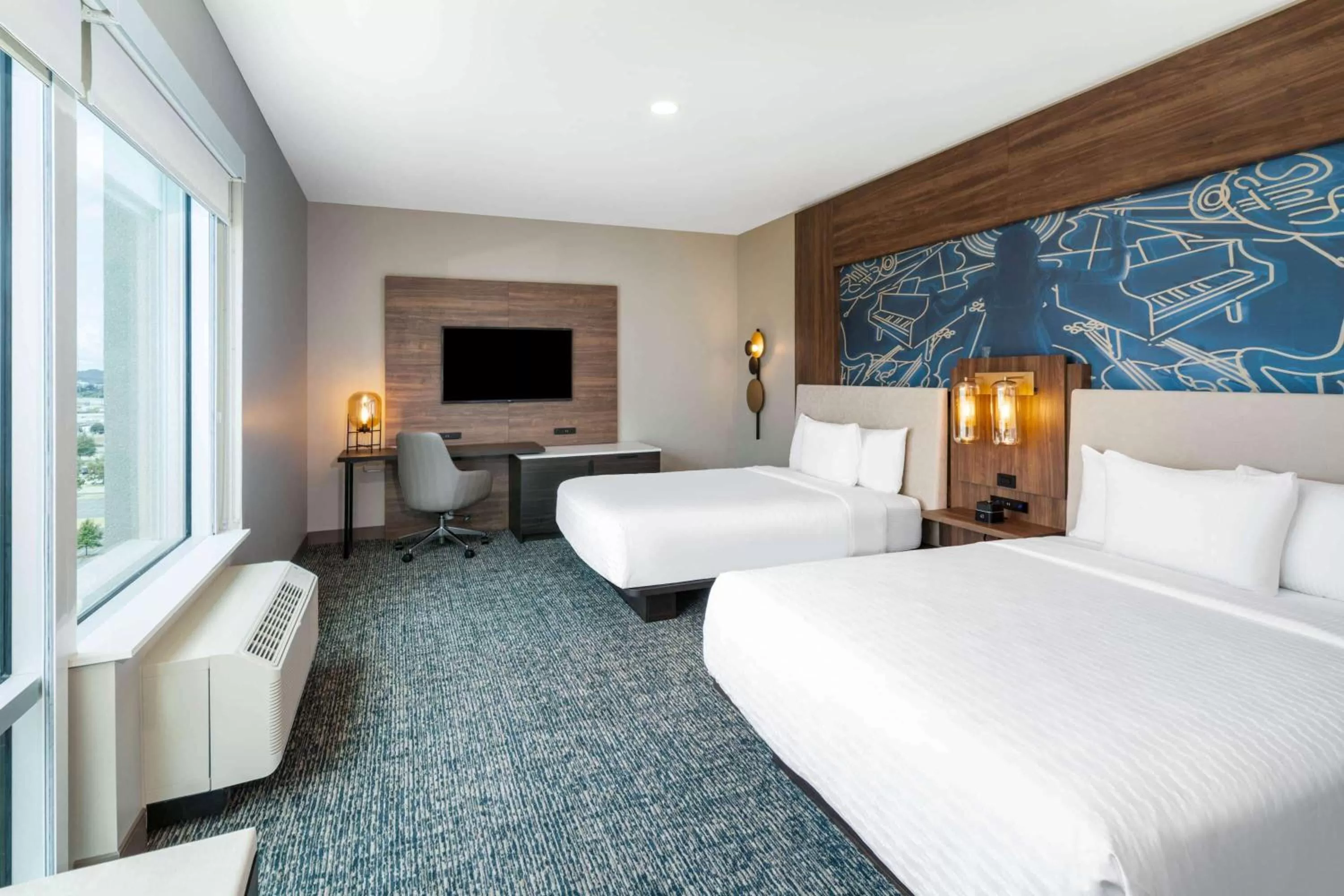 Photo of the whole room, Bed in La Quinta Inn & Suites by Wyndham Nashville Downtown Stadium