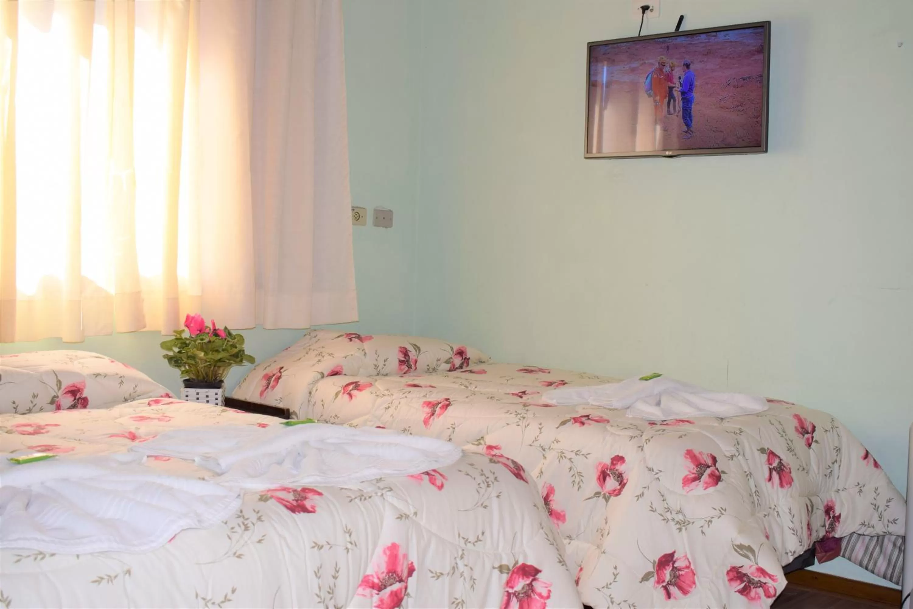 Bed in Pousada Curumi