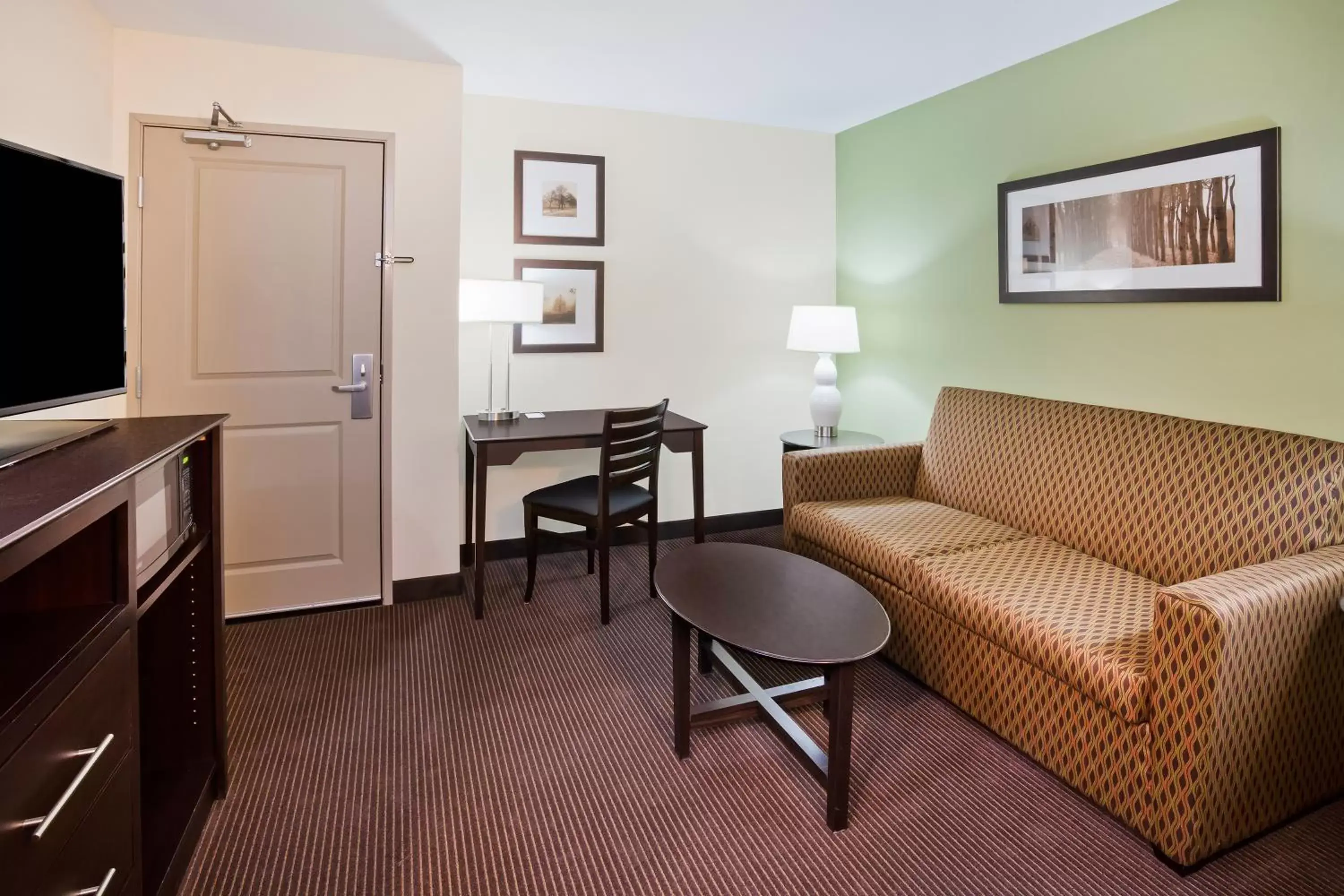 Photo of the whole room, Seating Area in AmericInn by Wyndham DeWitt