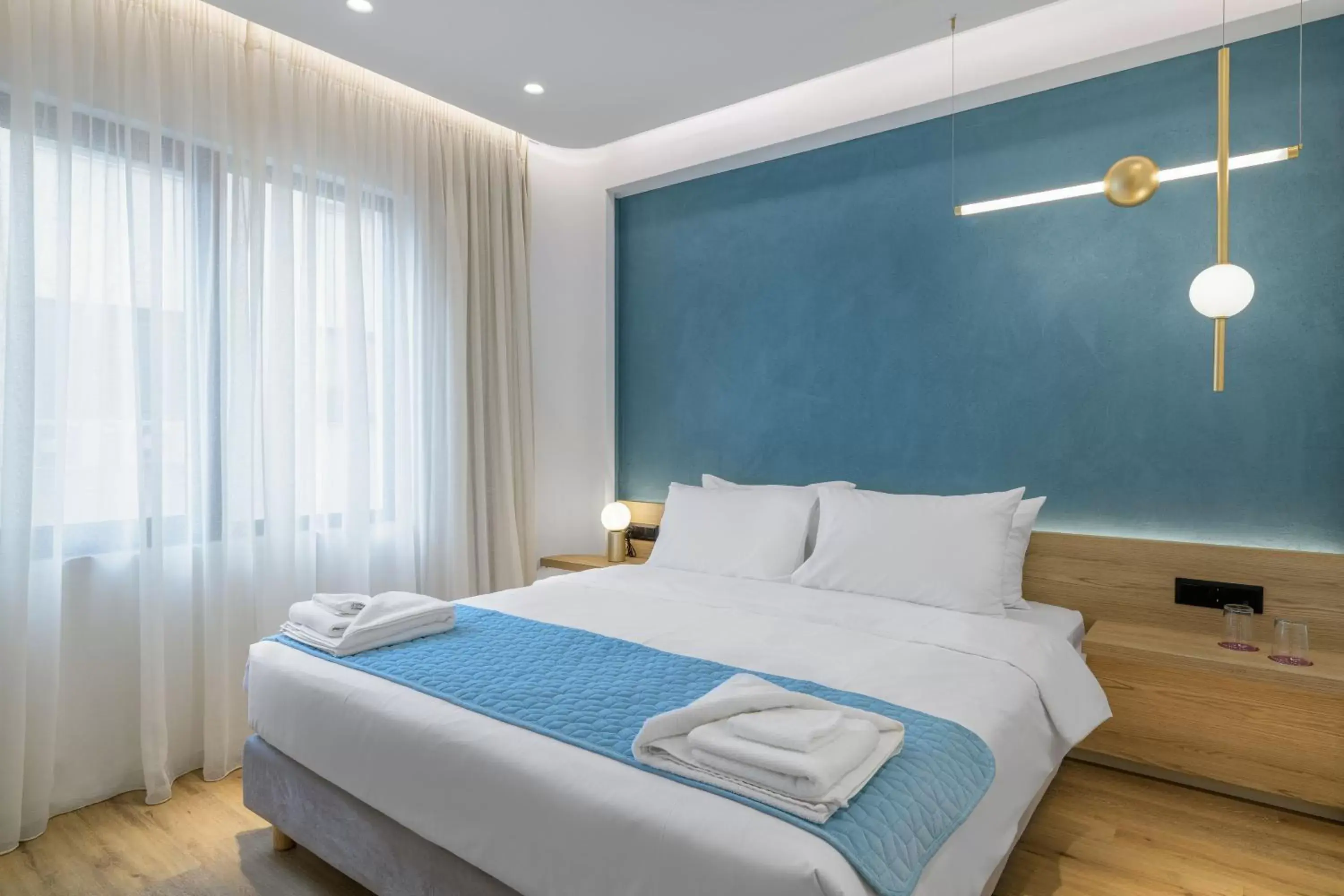 Bed in Acropolis Magenta Luxury Suites