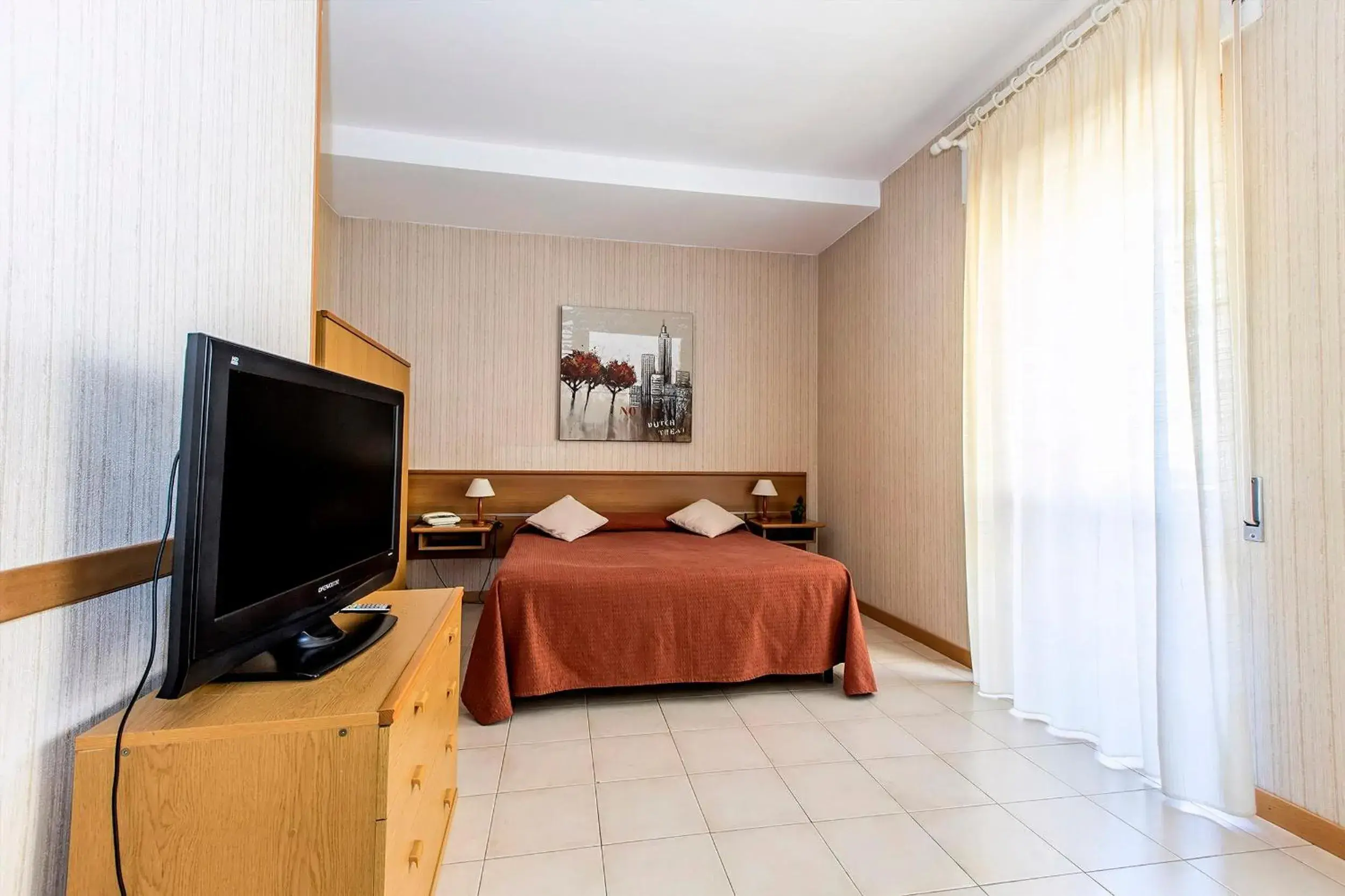 Bed, TV/Entertainment Center in Hotel Residence Ulivi E Palme