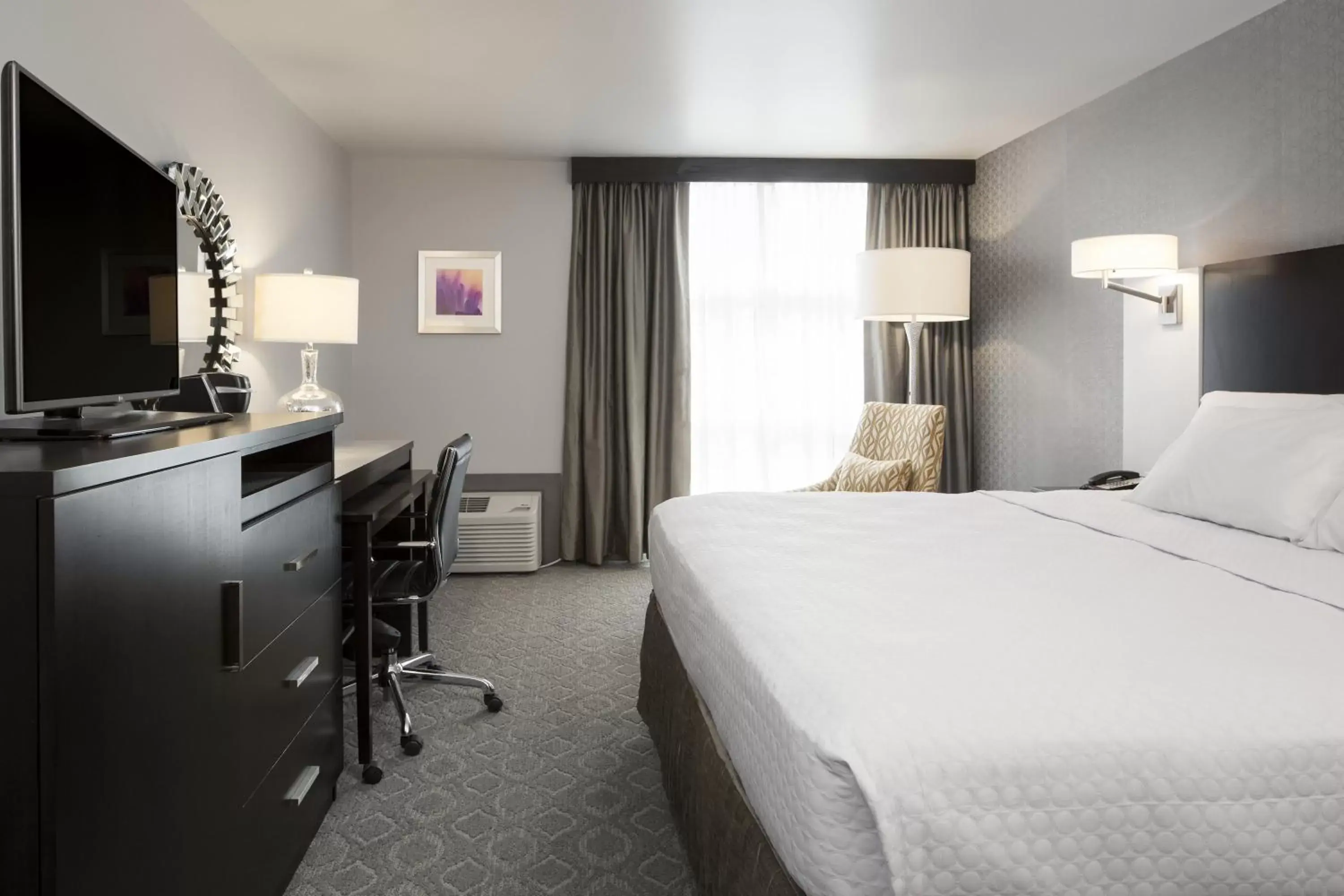 Photo of the whole room, Bed in Crowne Plaza Chicago SW - Burr Ridge, an IHG Hotel