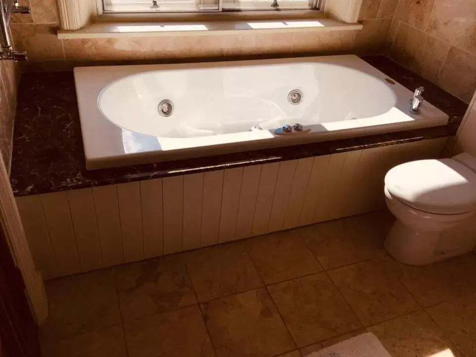 Bathroom in Brass Castle Country House Accommodation