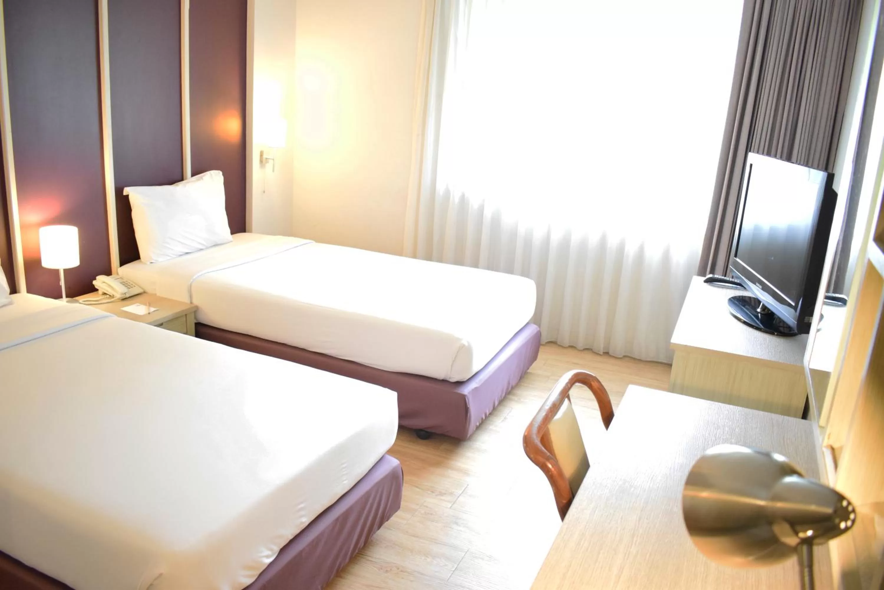Bed in Trang Hotel Bangkok - SHA Plus