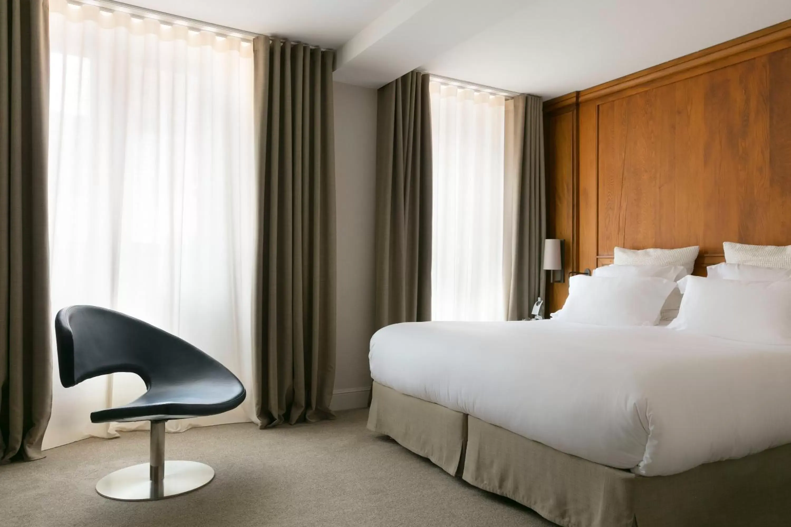 Bed in Relais & Châteaux La Maison Des Têtes Bed in Relais & Châteaux La Maison Des Têtes