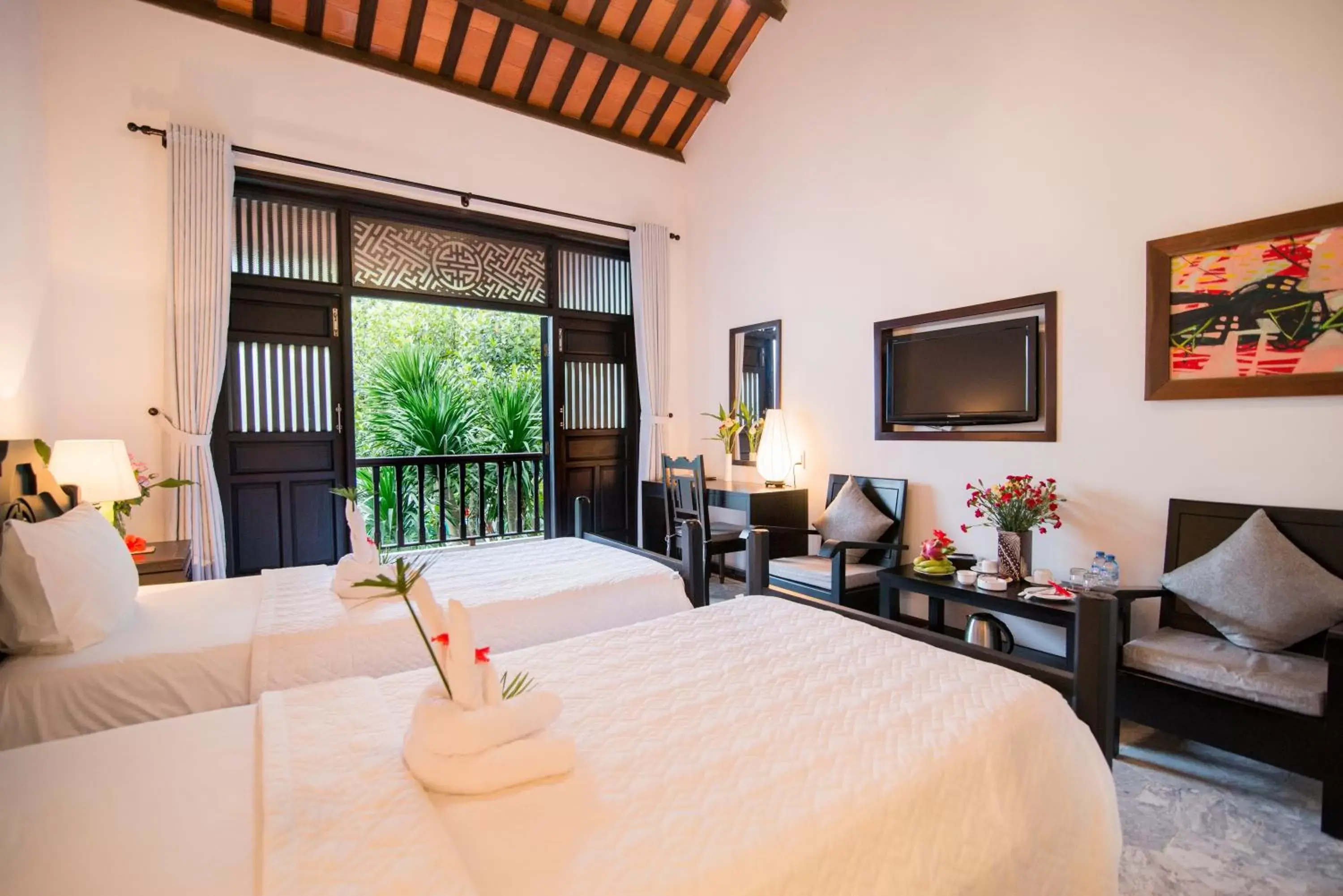 Seating area, Bed in Hoi An Ancient House Resort & Spa
