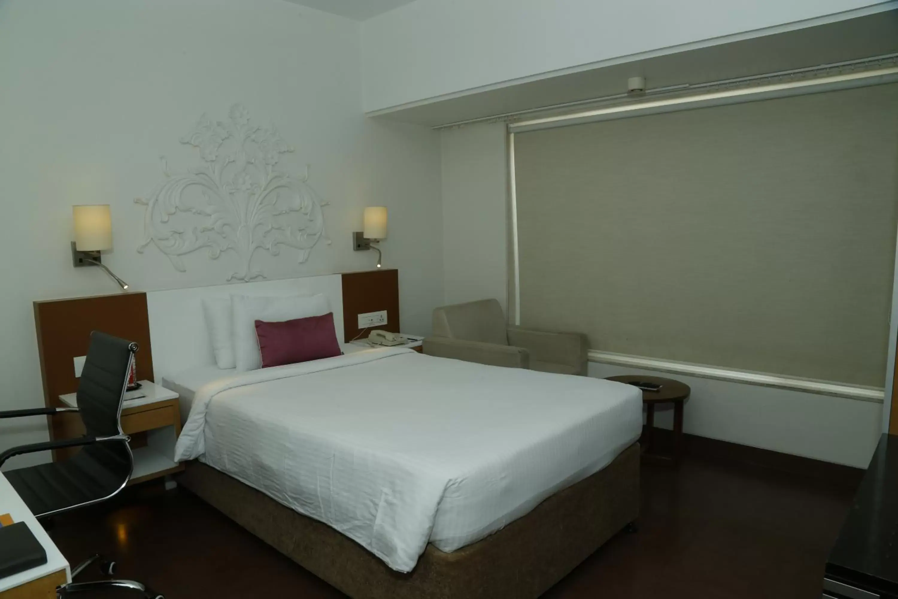 Bed in Sarovar Portico Rivera Ahmedabad