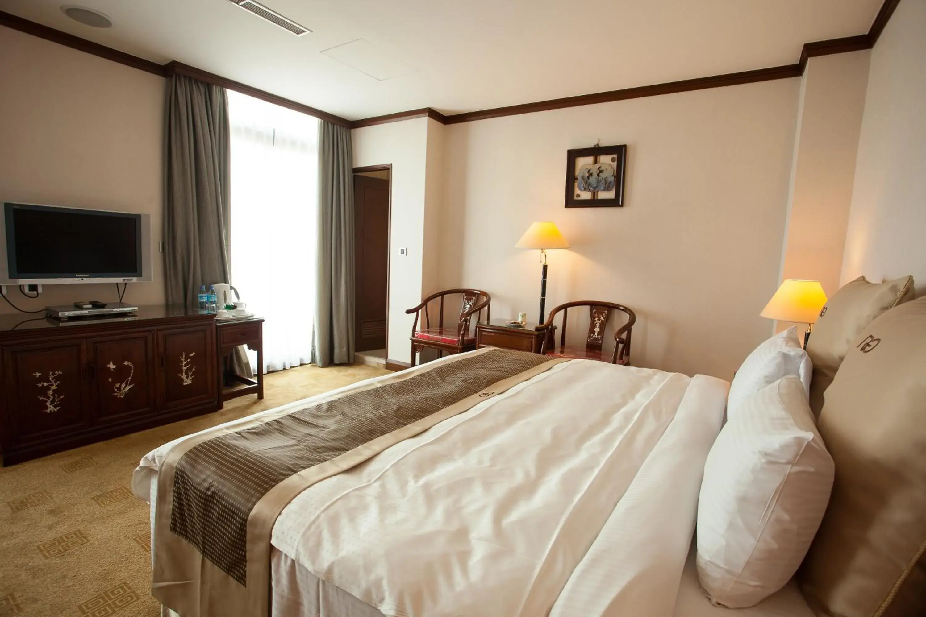 Photo of the whole room, Bed in Rich Garden Hotel