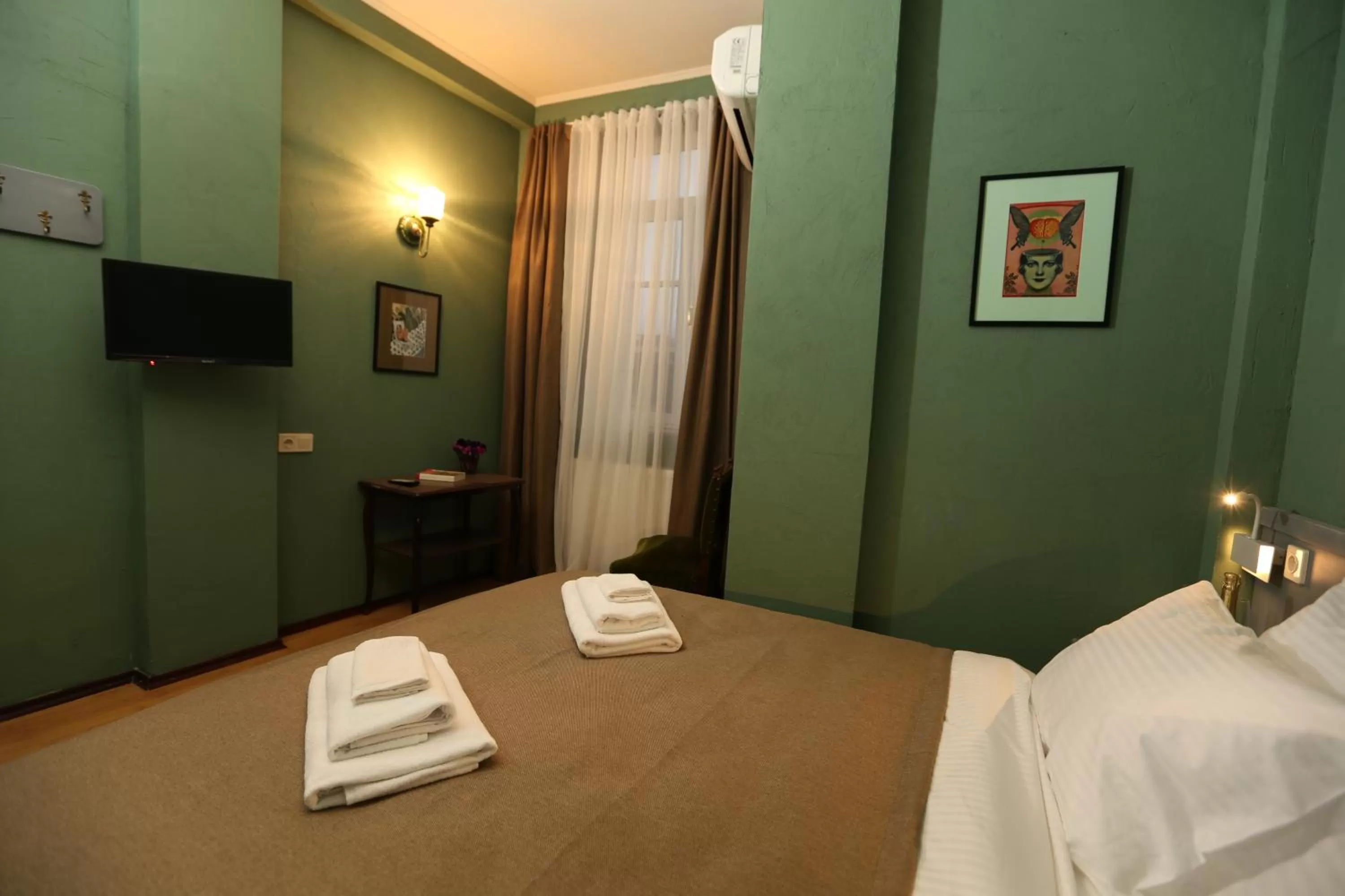 Bed in Kindli Boutique Hotel